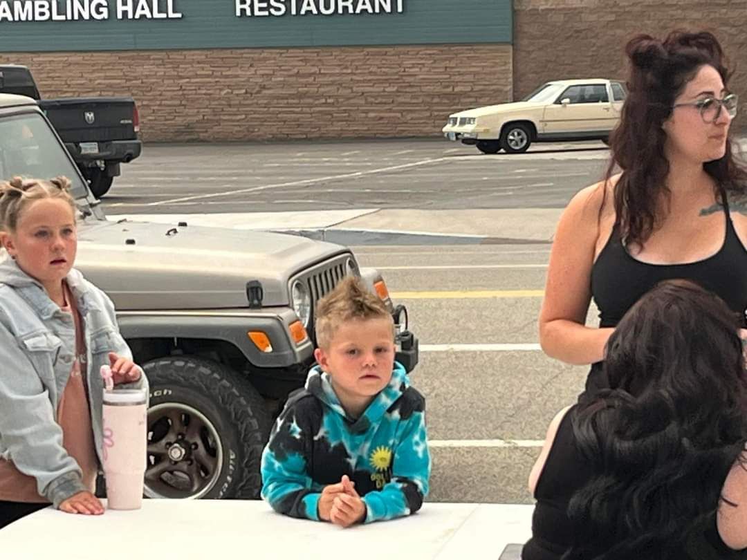 A woman and two children watching skaters enjoying Skate Night 2024 in Hawthorne, Mineral County, NV.