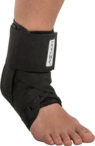 A Person Is Wearing A Black Ankle Brace On Their Foot — Alice Springs Podiatry in Ciccone, NT