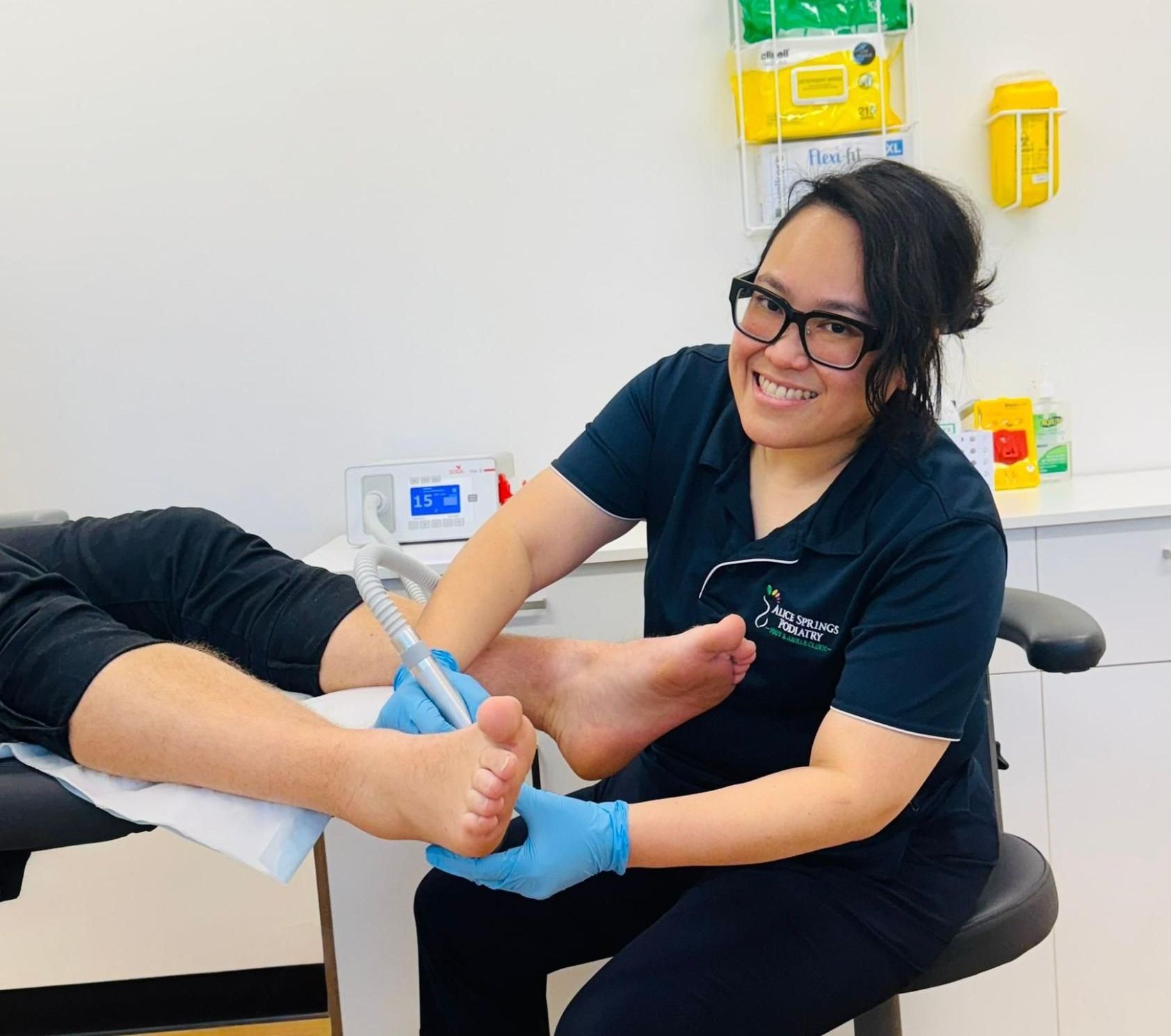 A Podiatrist Uses a Tool to Treat a Patient's Foot — Alice Springs Podiatry in Ciccone, NT