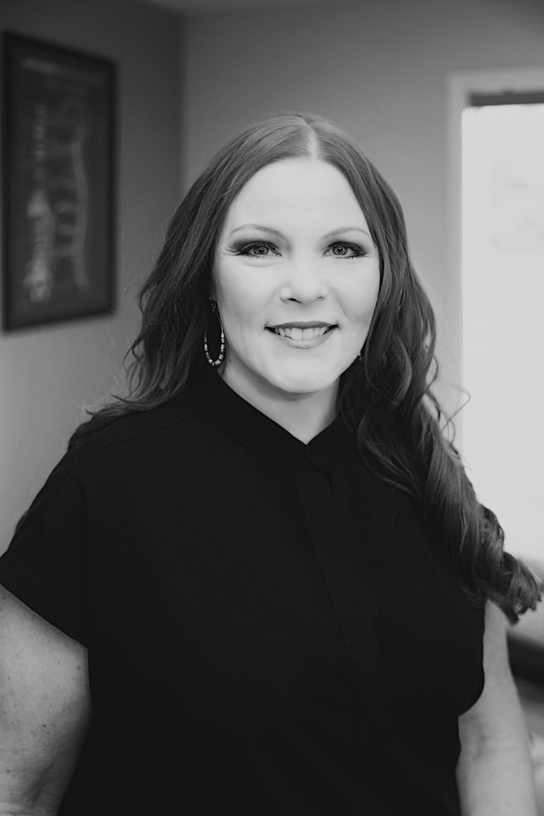 Black and white portrait of a woman smiling
