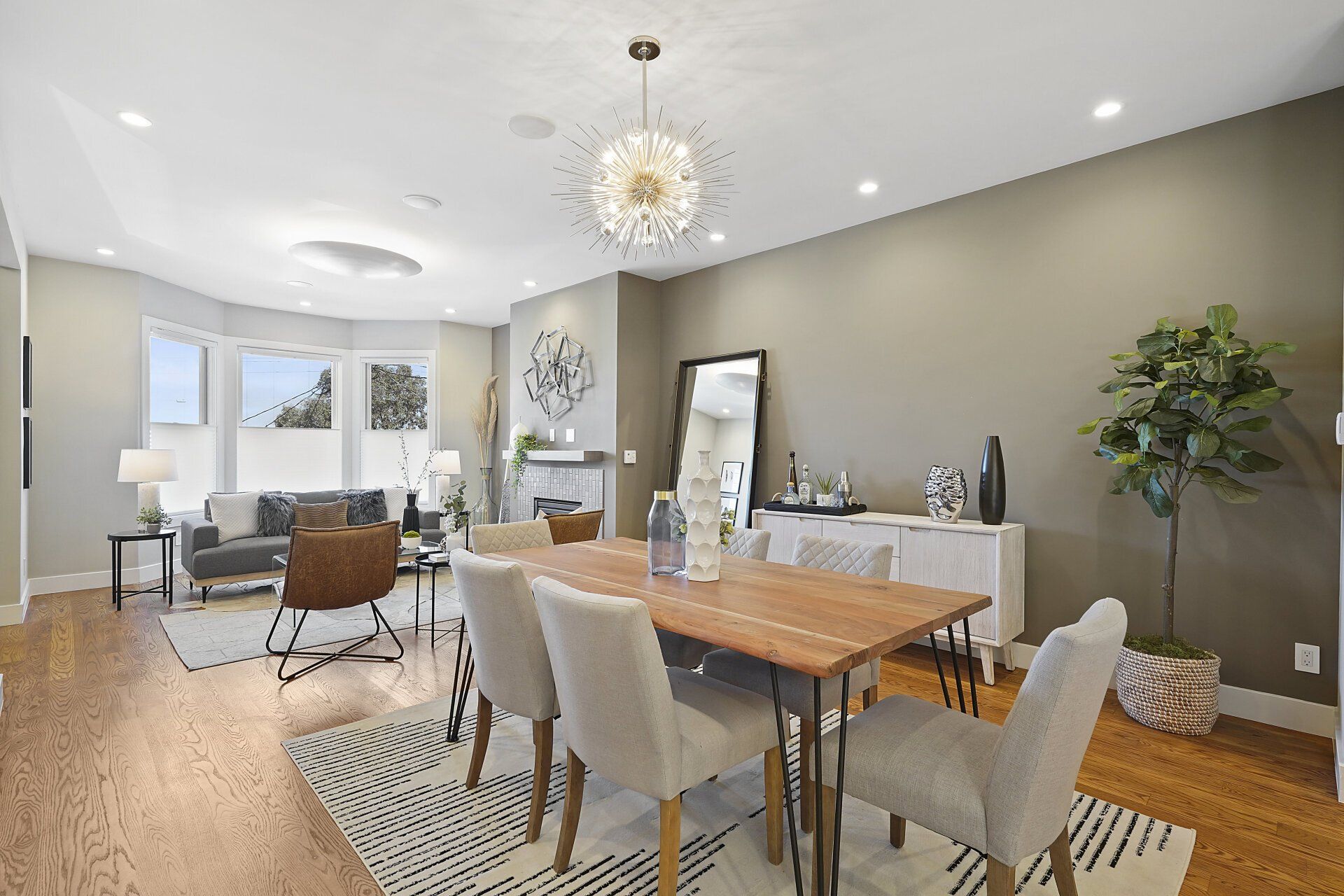 A dining room with a wooden table and chairs.