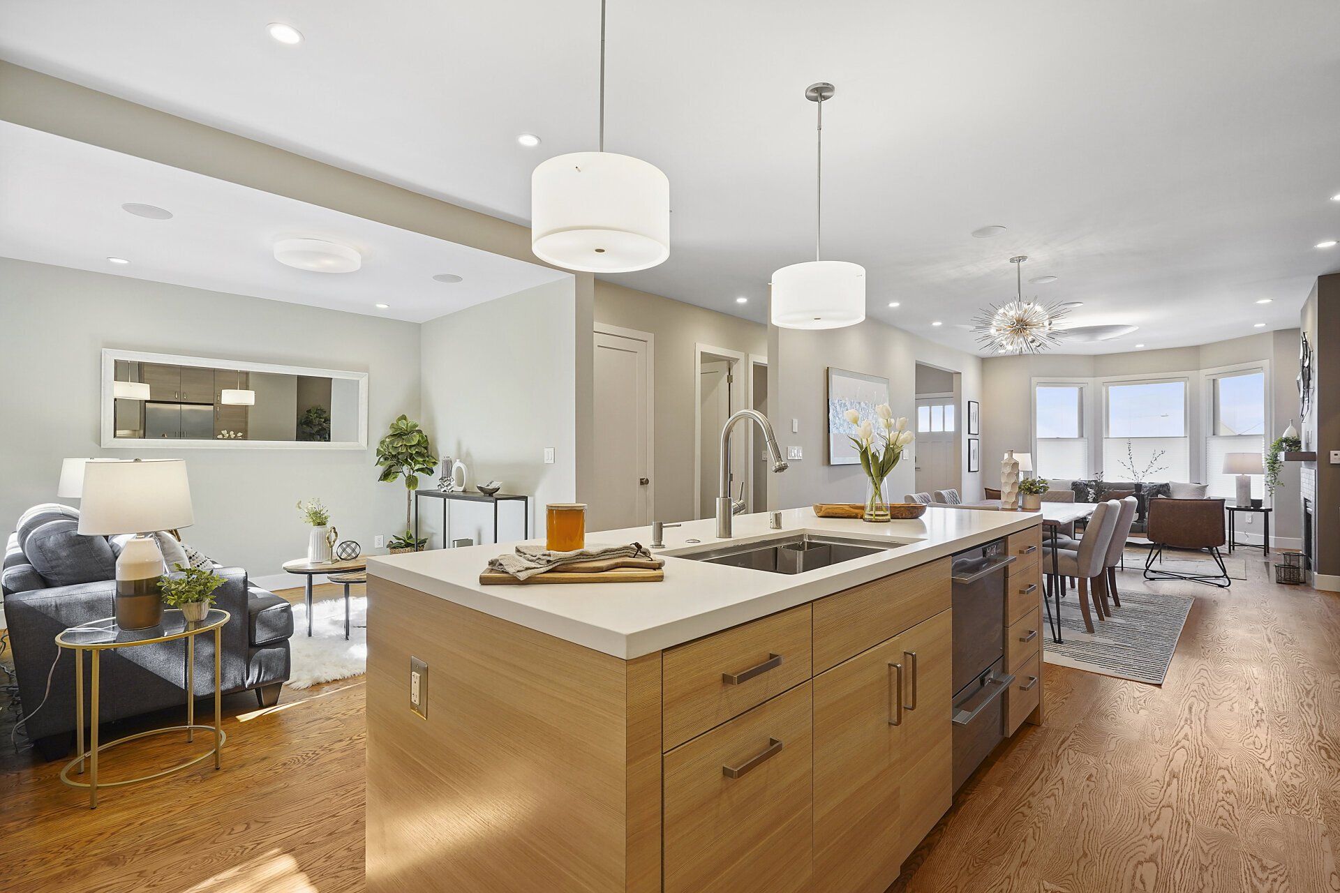 A kitchen with an island and a sink.