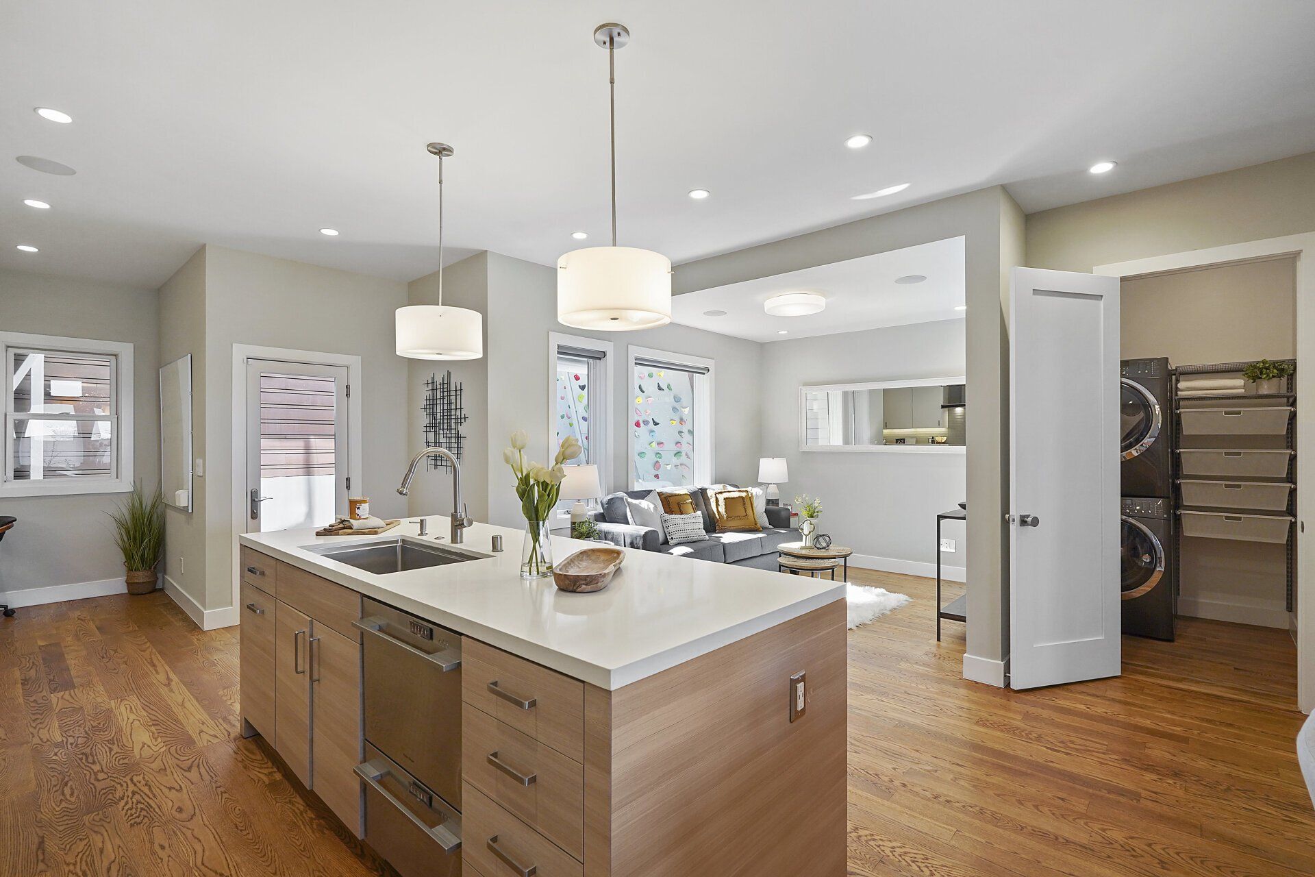 A kitchen with an island and stainless steel appliances.