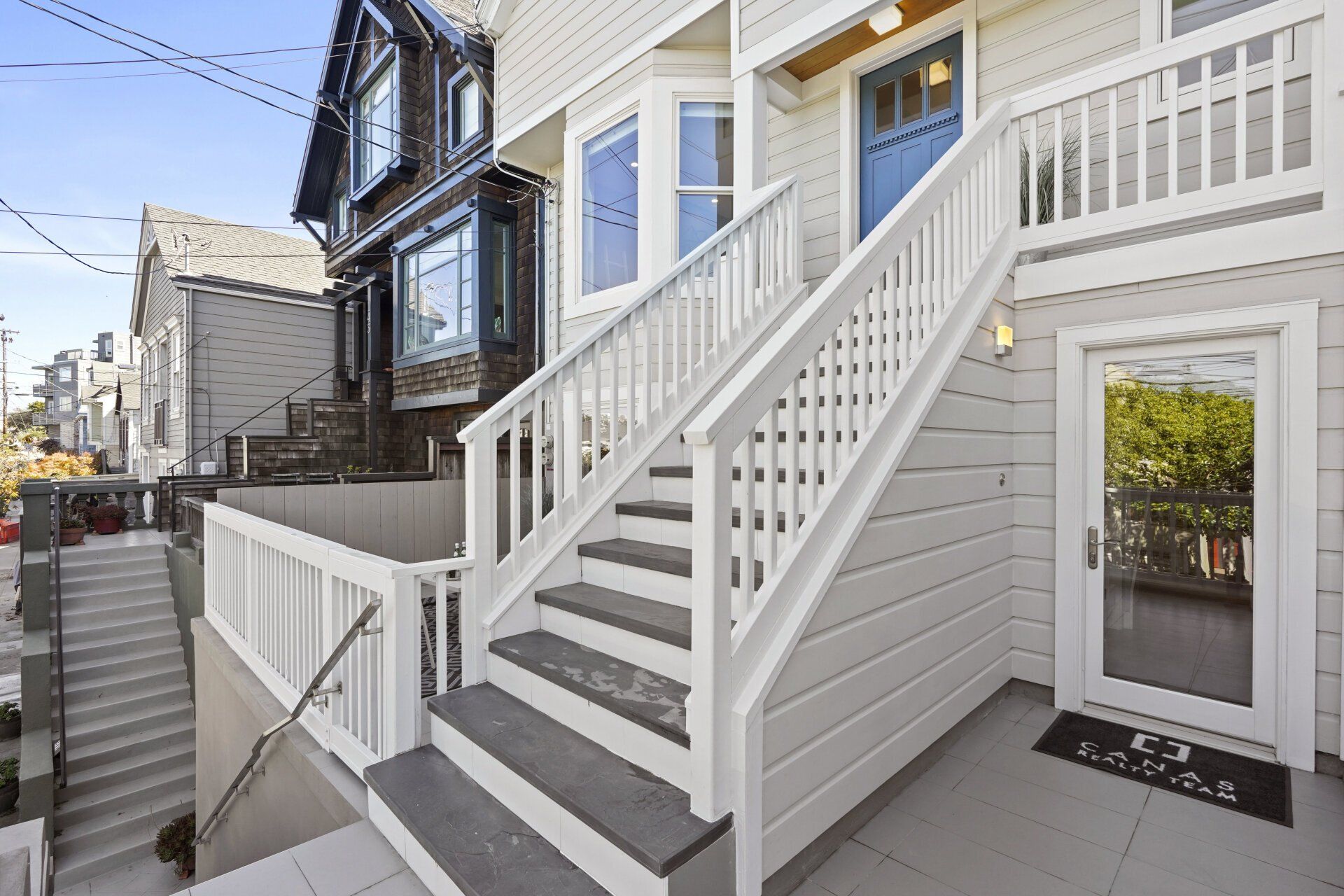 A white house with stairs.