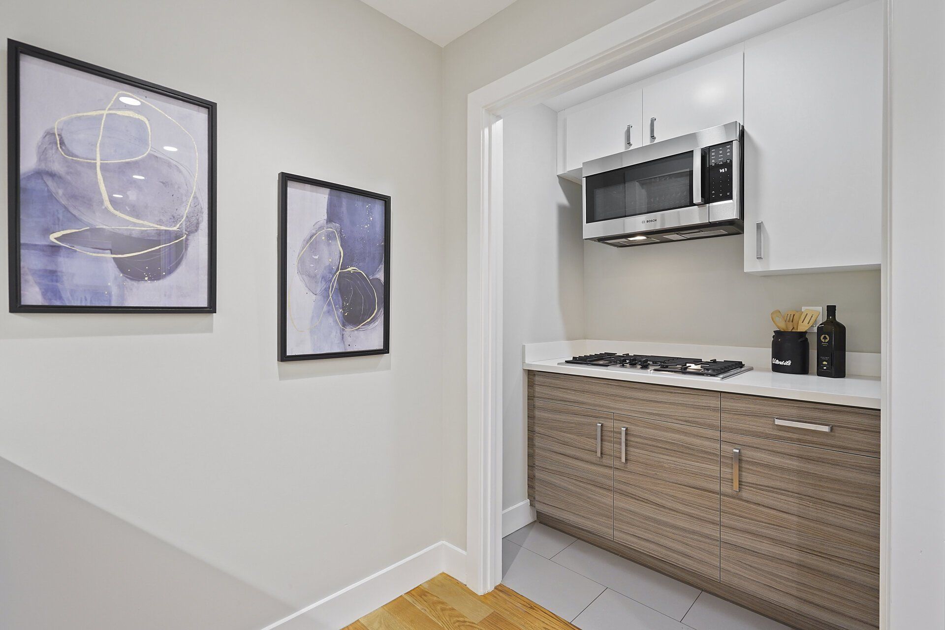 A kitchen with stainless steel appliances and wooden cabinets.