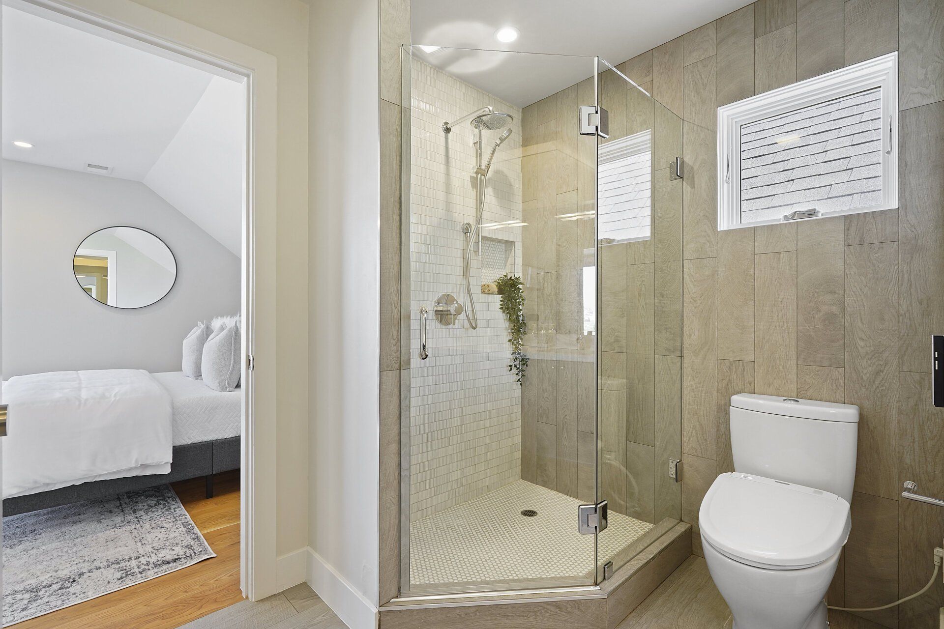 A bathroom with a toilet and shower.