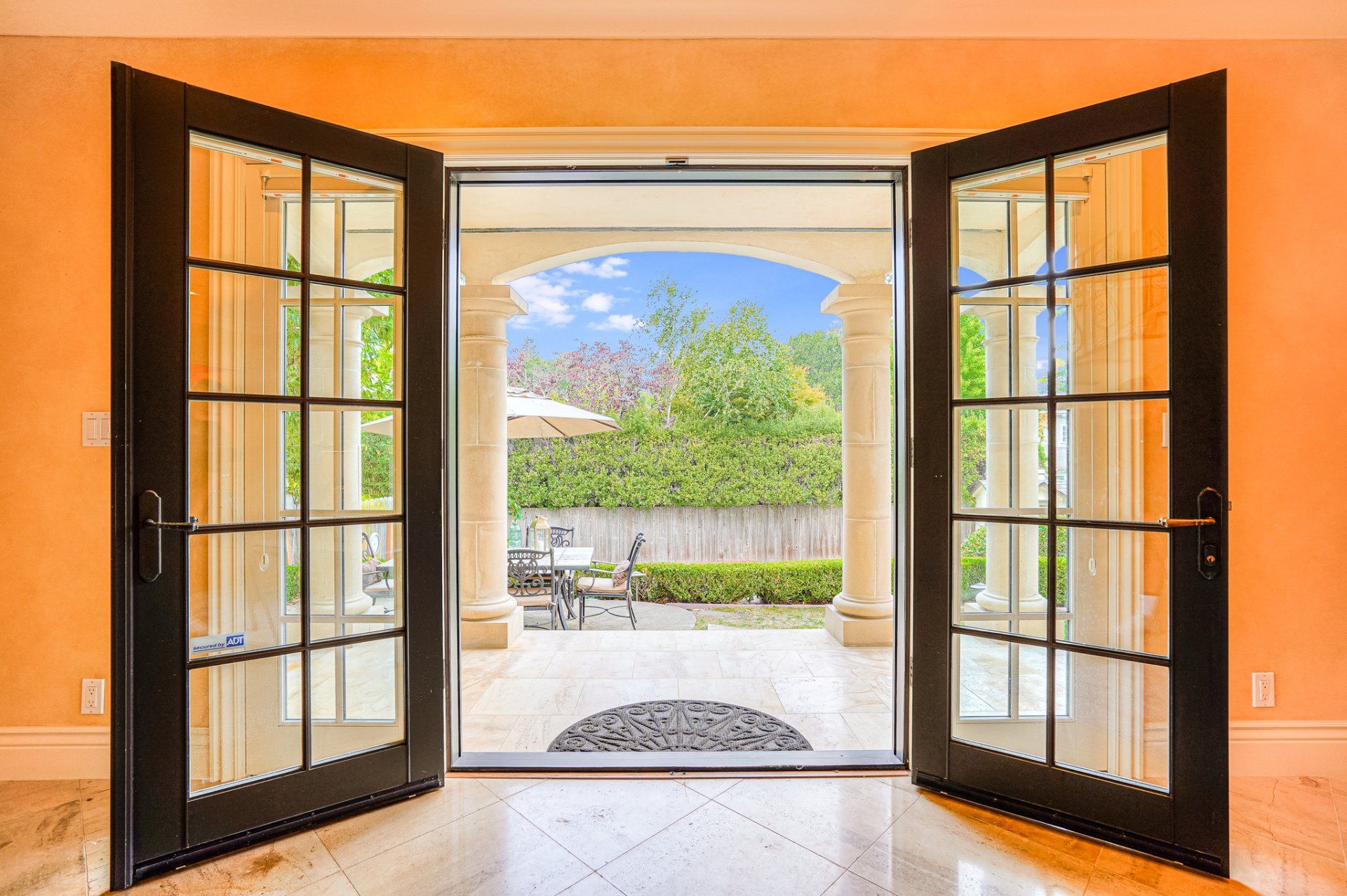 The doors are open and looking out to a patio.