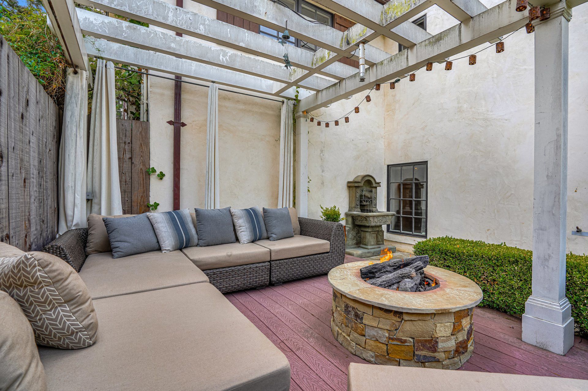 There is a fire pit in the middle of the patio.