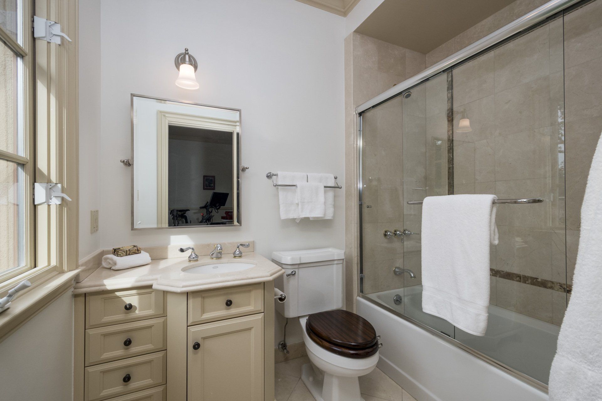 A bathroom with a toilet a sink and a bathtub