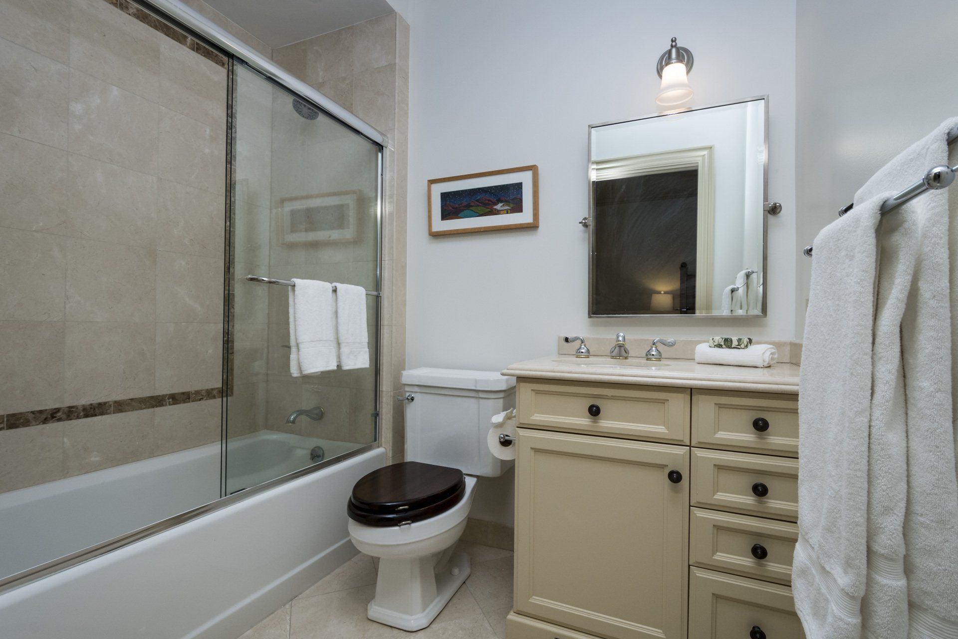 A bathroom with a toilet a sink and a bathtub