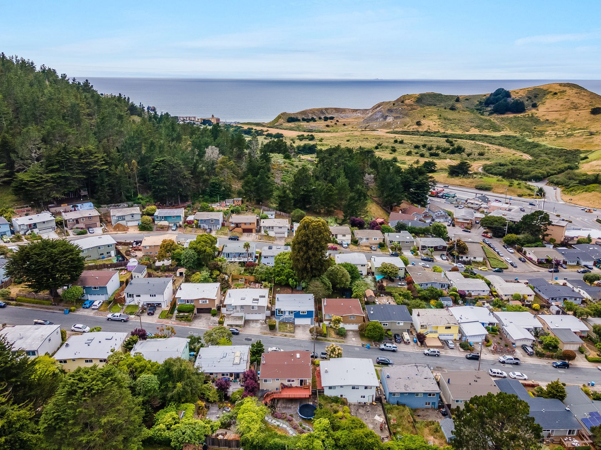 An aerial view of a residential area with lots of houses and trees.