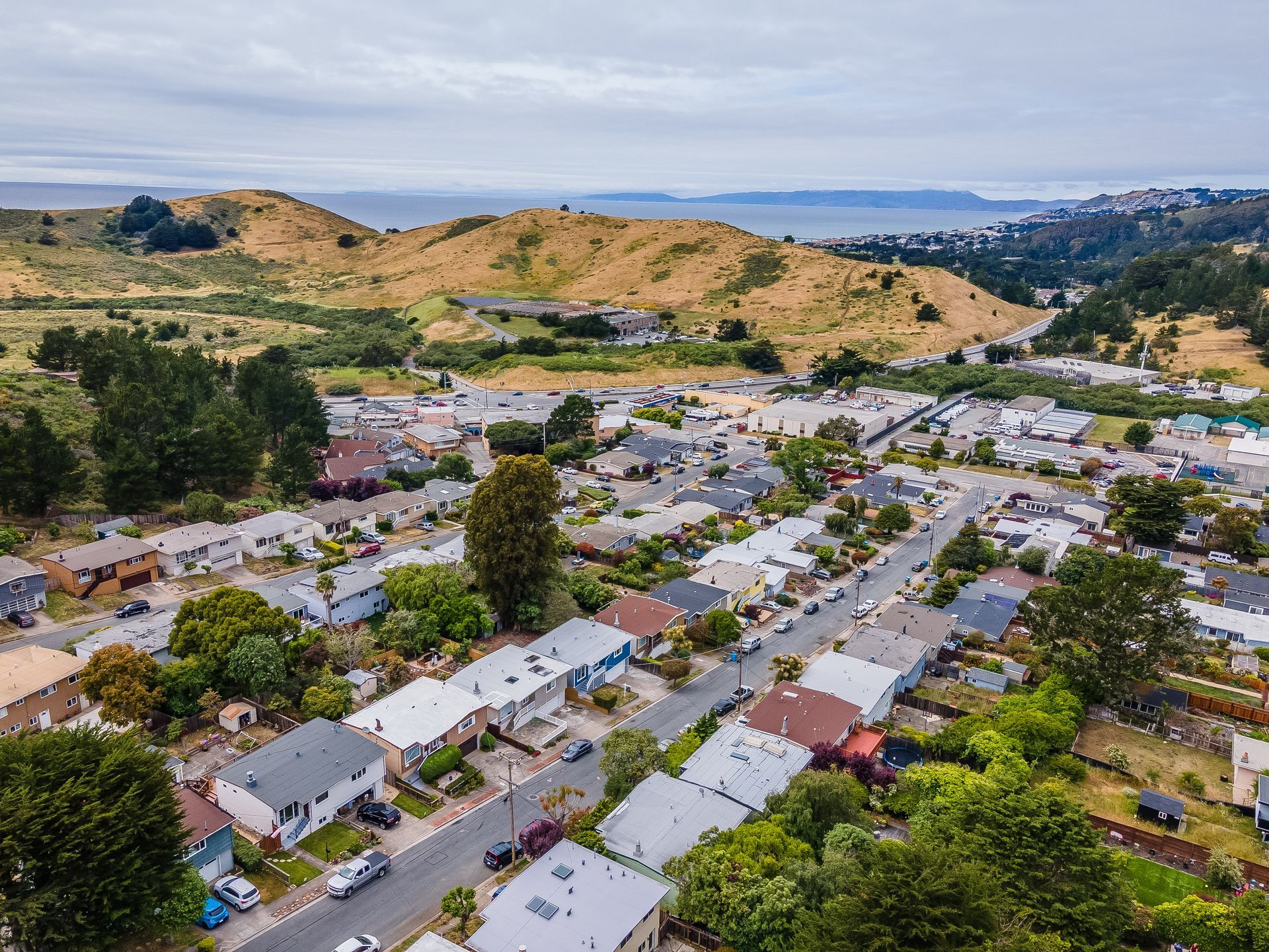 An aerial view of a residential area with lots of houses and trees.