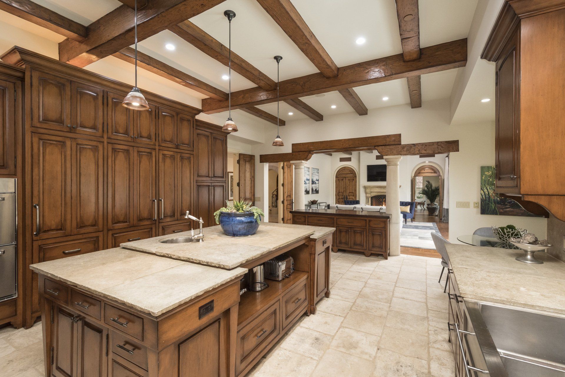 A kitchen with a large island and a sink