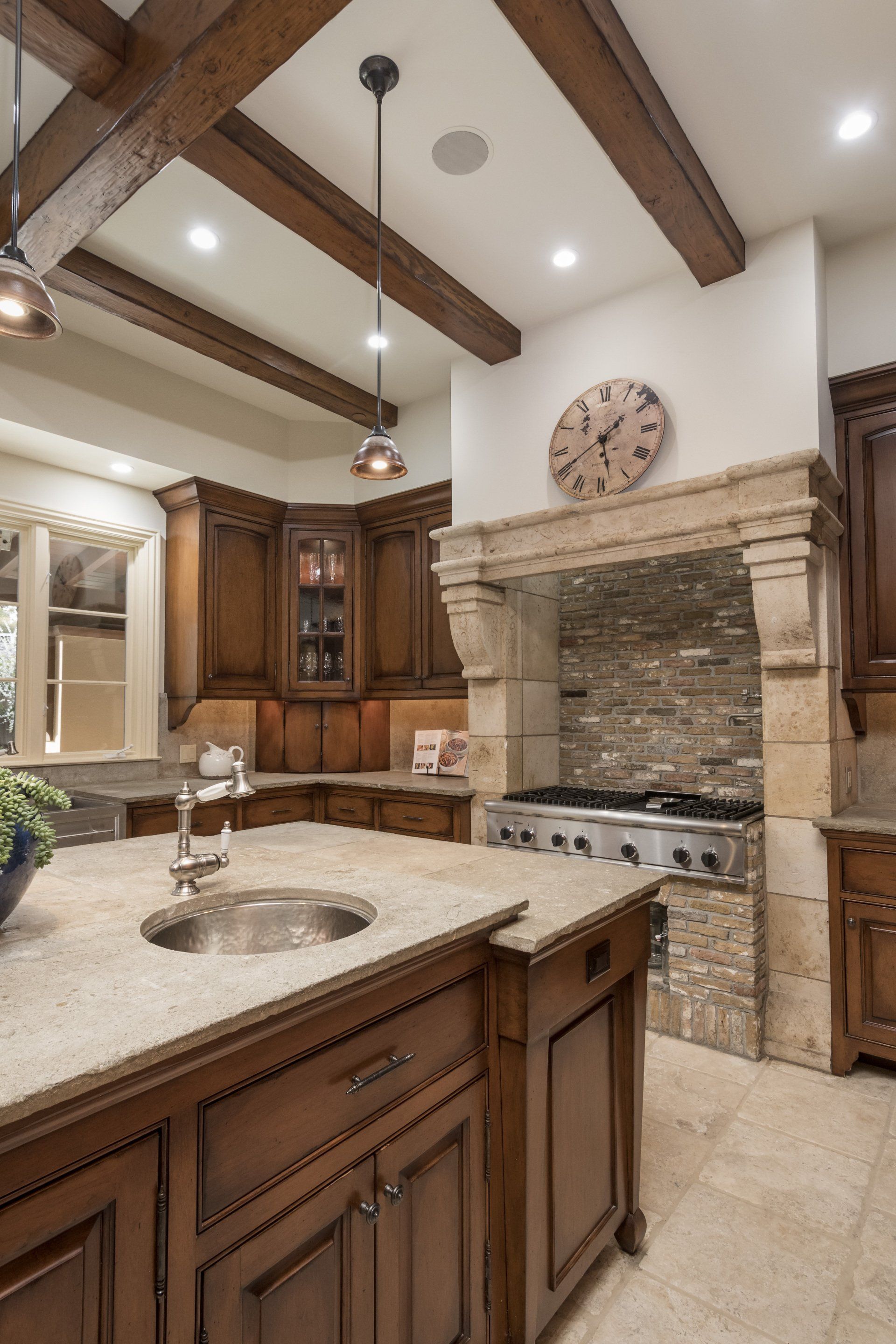 A kitchen with wooden cabinets and a clock on the wall