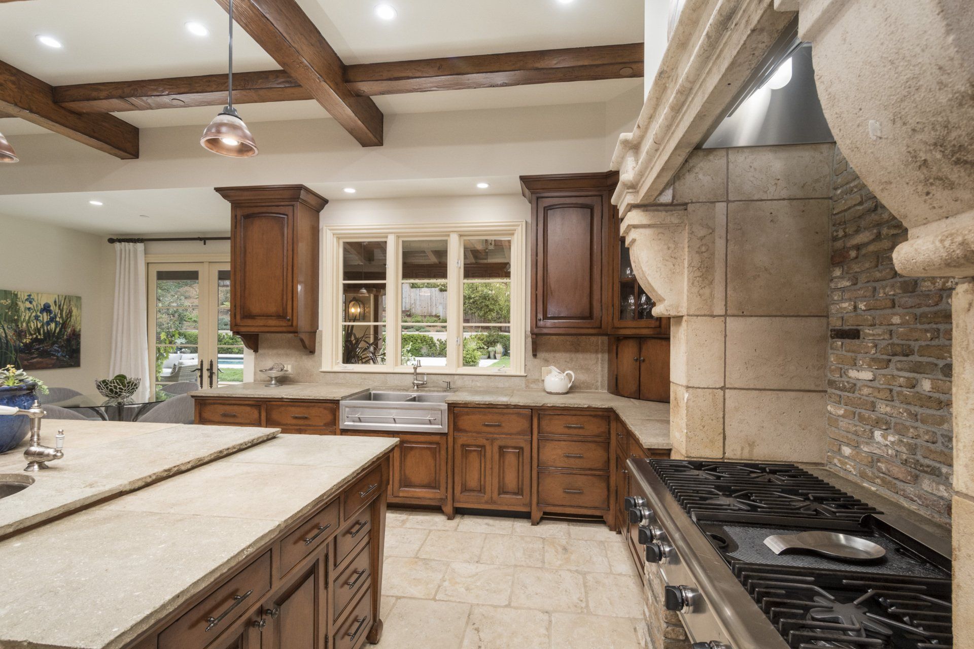 A kitchen with stainless steel appliances and wooden cabinets