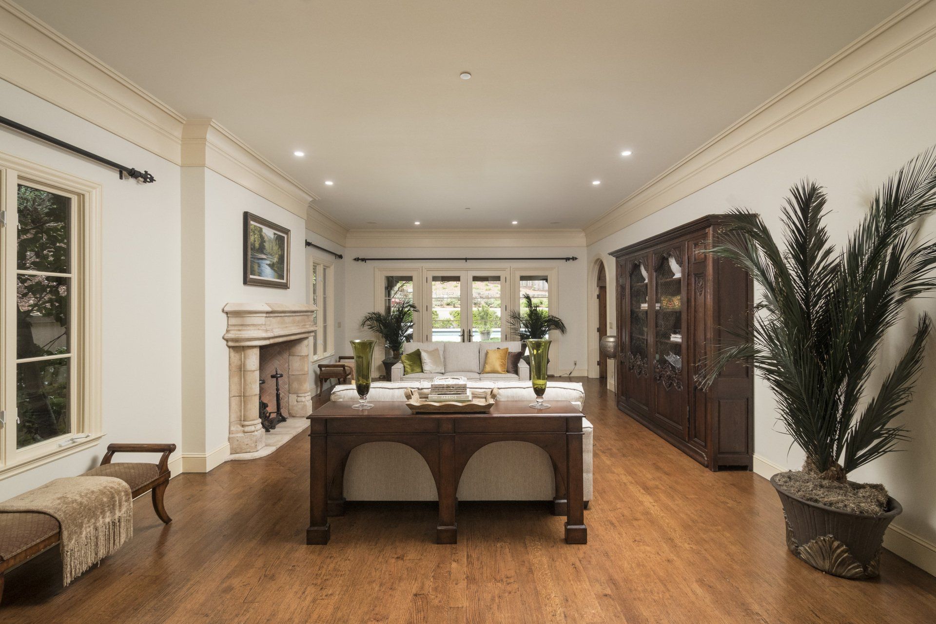 A living room with hardwood floors and a fireplace
