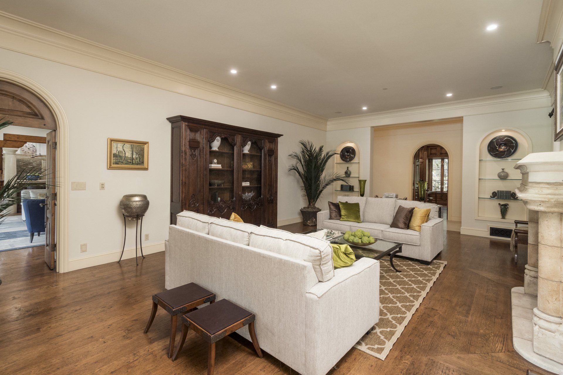 A living room with two couches and a fireplace