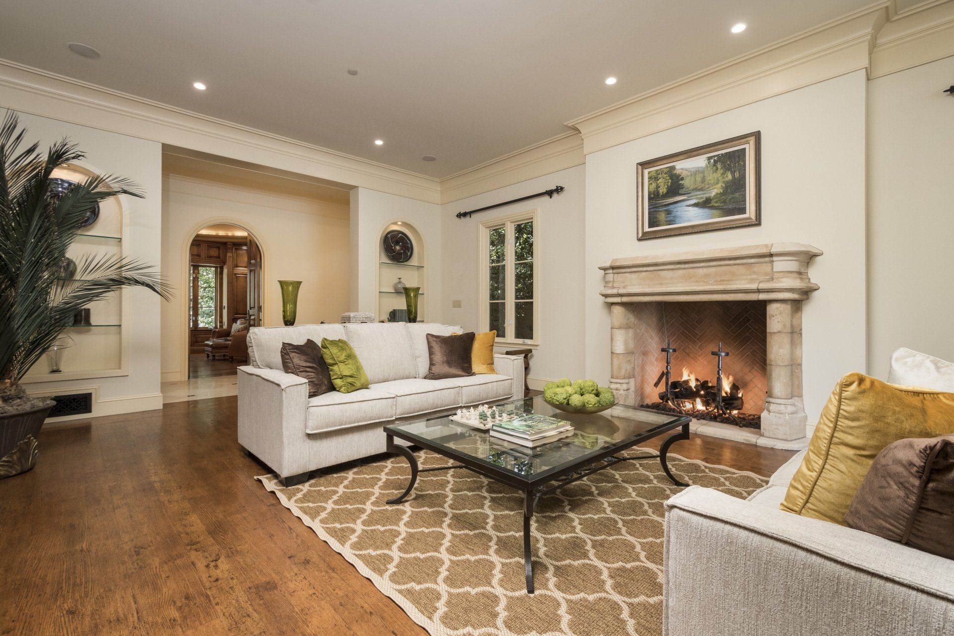 A living room with a fireplace and two couches