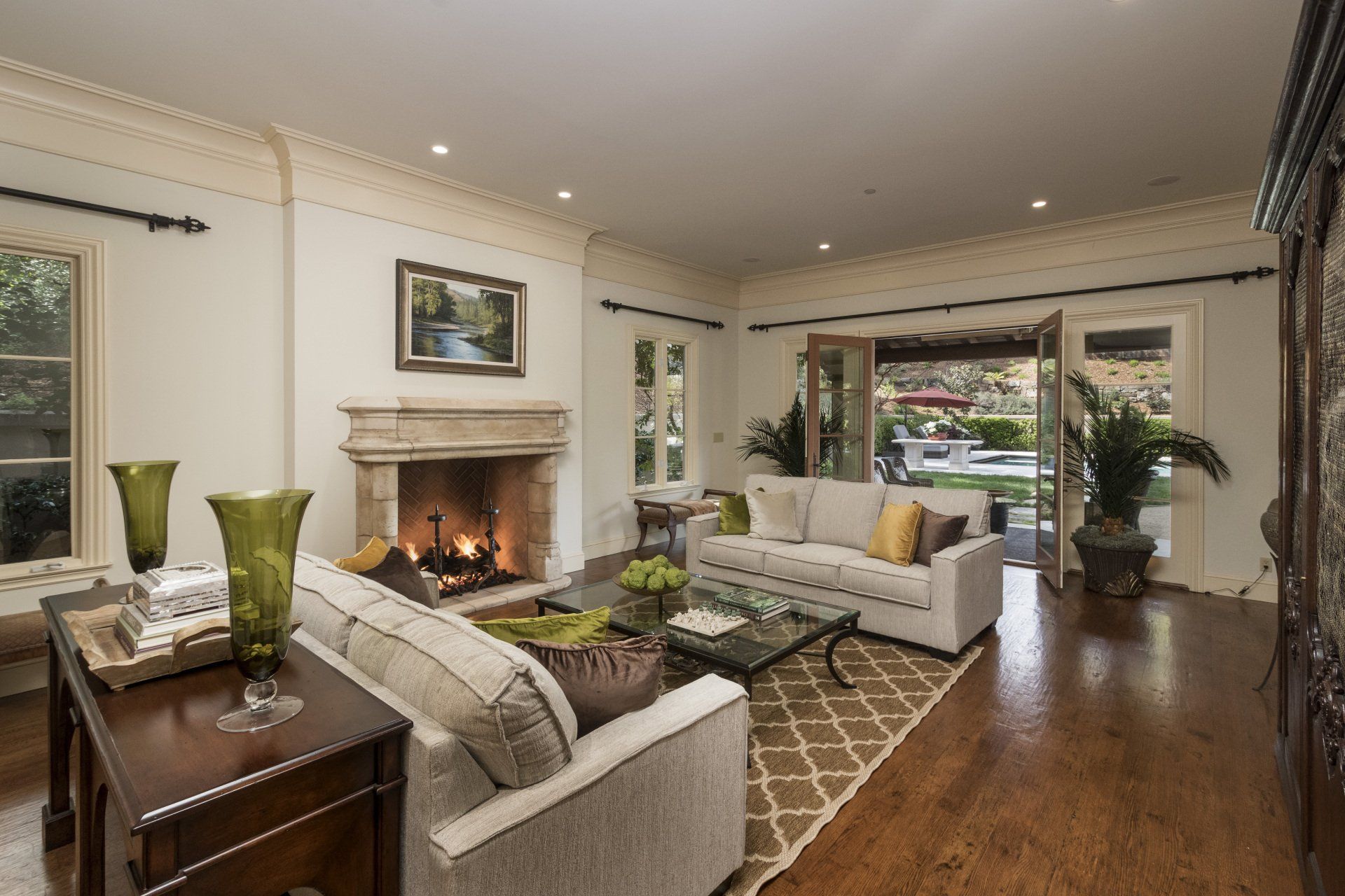 A living room with a fireplace and two couches