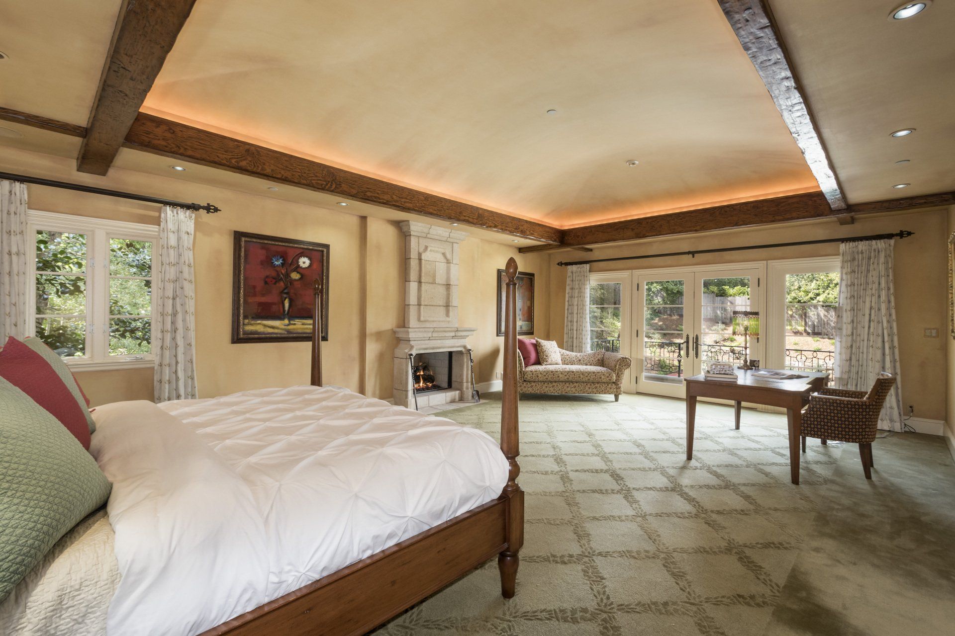 A bedroom with a bed and a fireplace