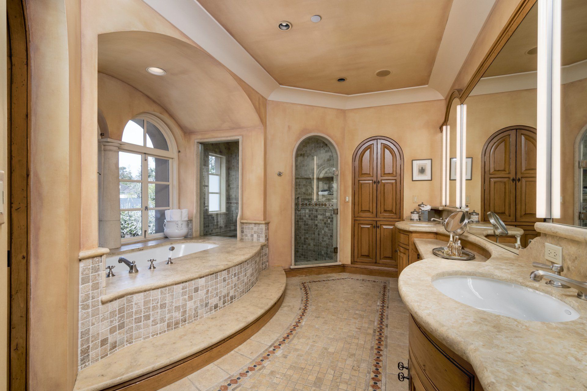 A bathroom with two sinks and a bathtub