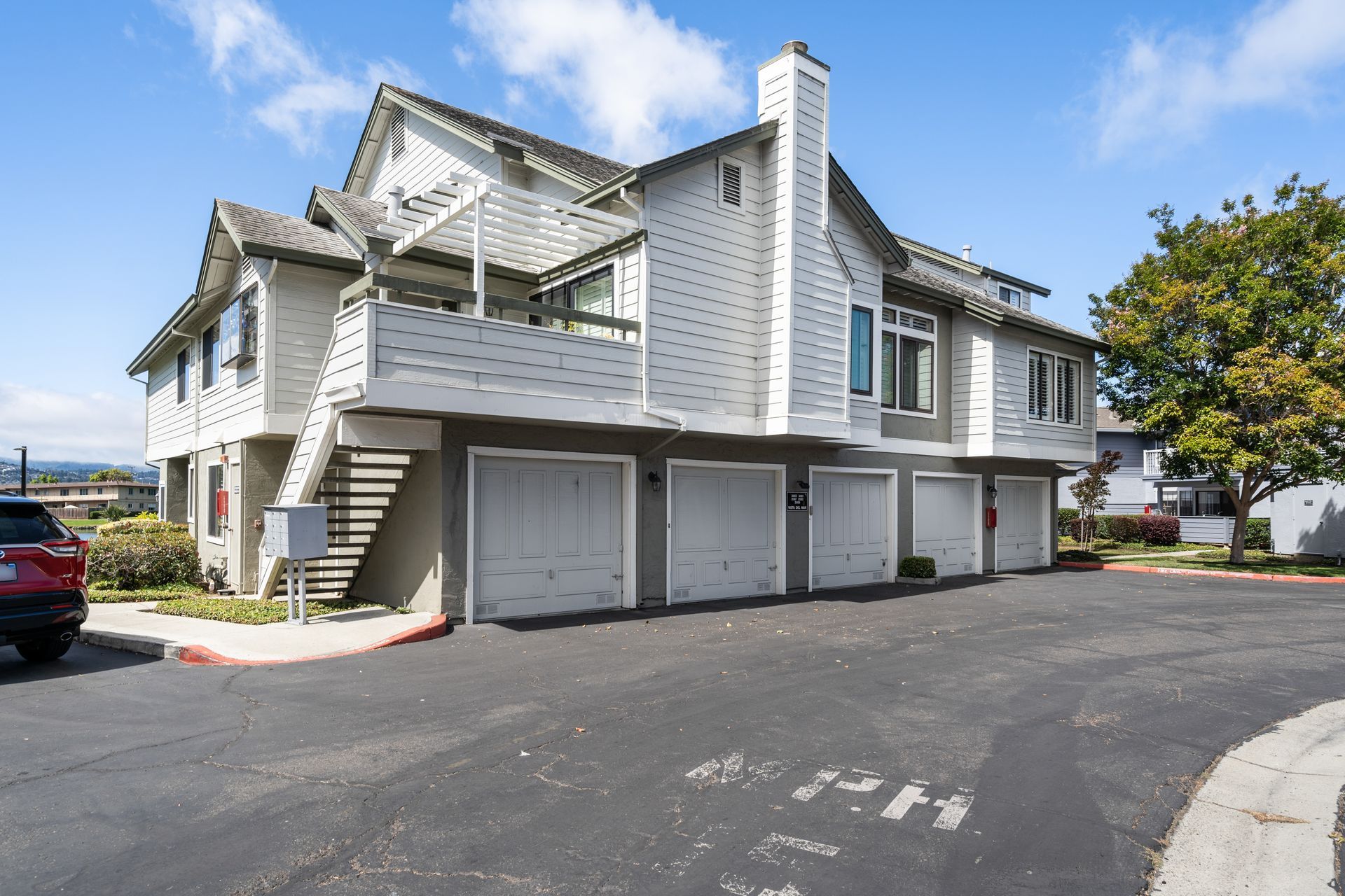 A large white house with a lot of garages