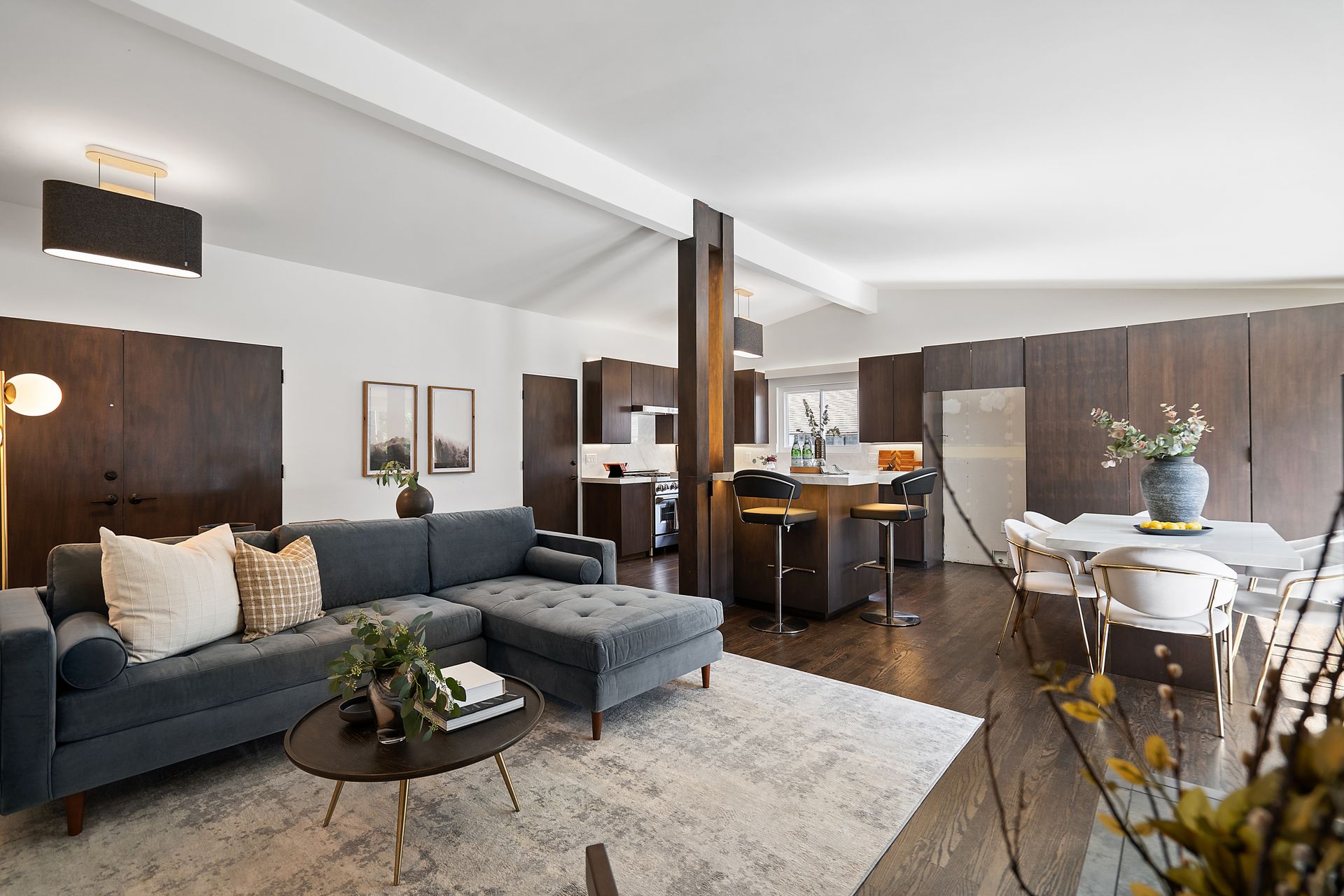 A living room with a couch and a table.