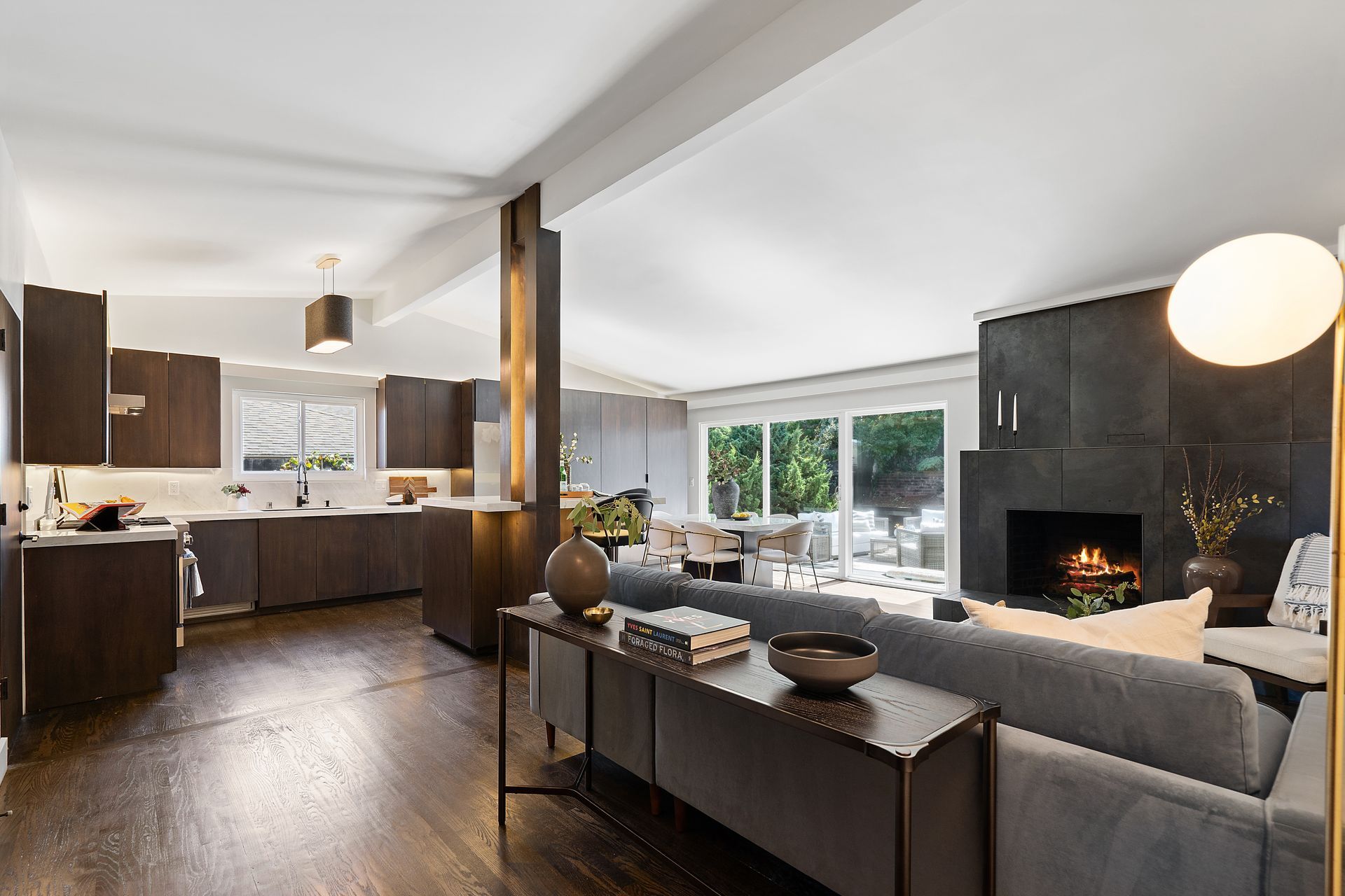 A living room with a couch and a lamp.