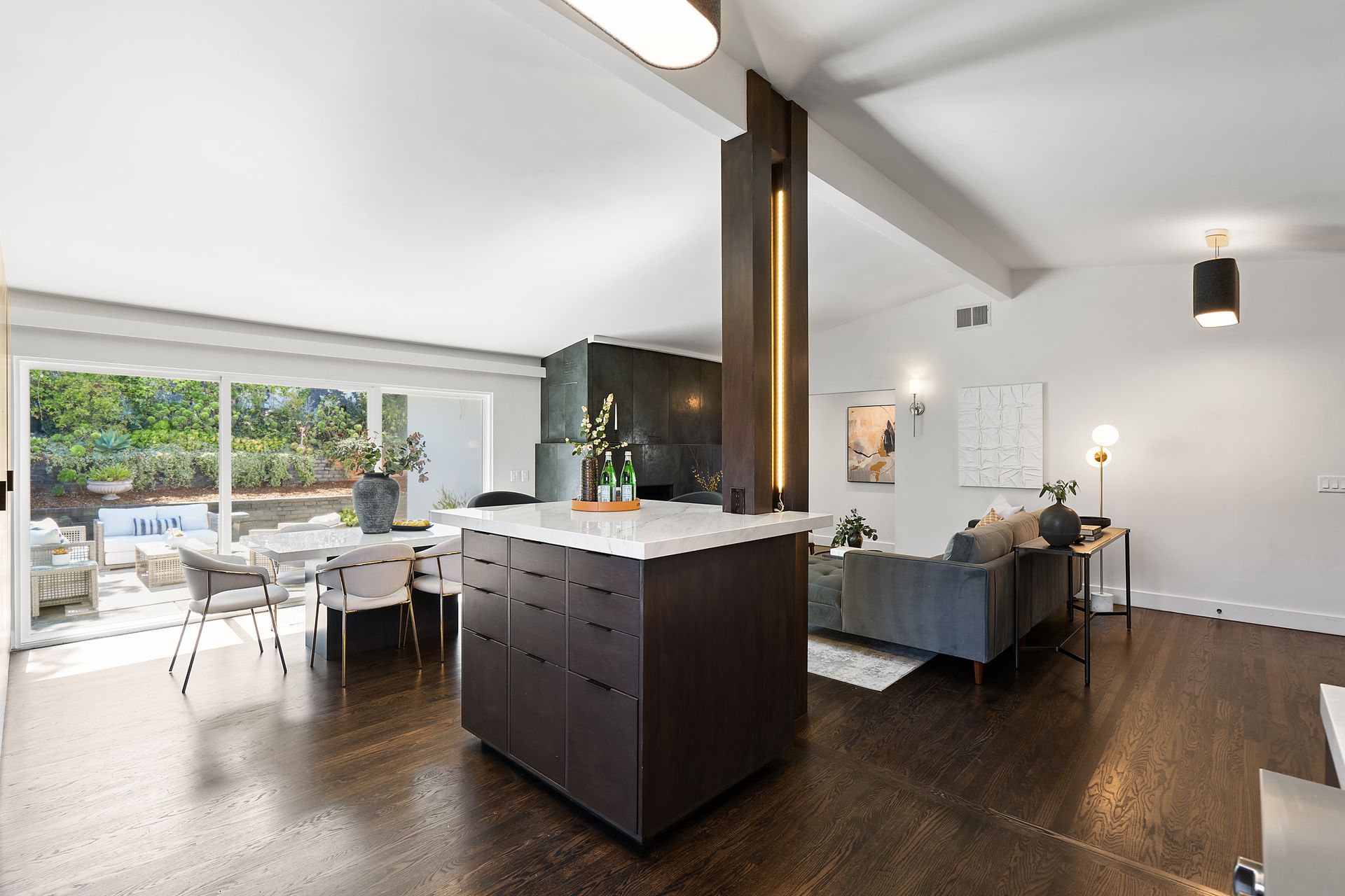 A living room with an island in the middle.