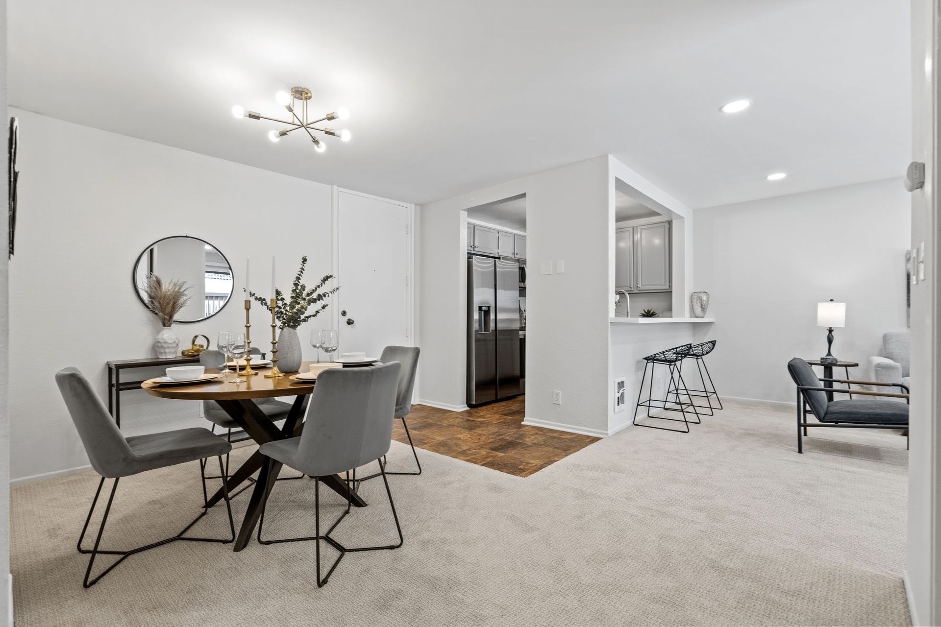 A dining room with a table and chairs in it.