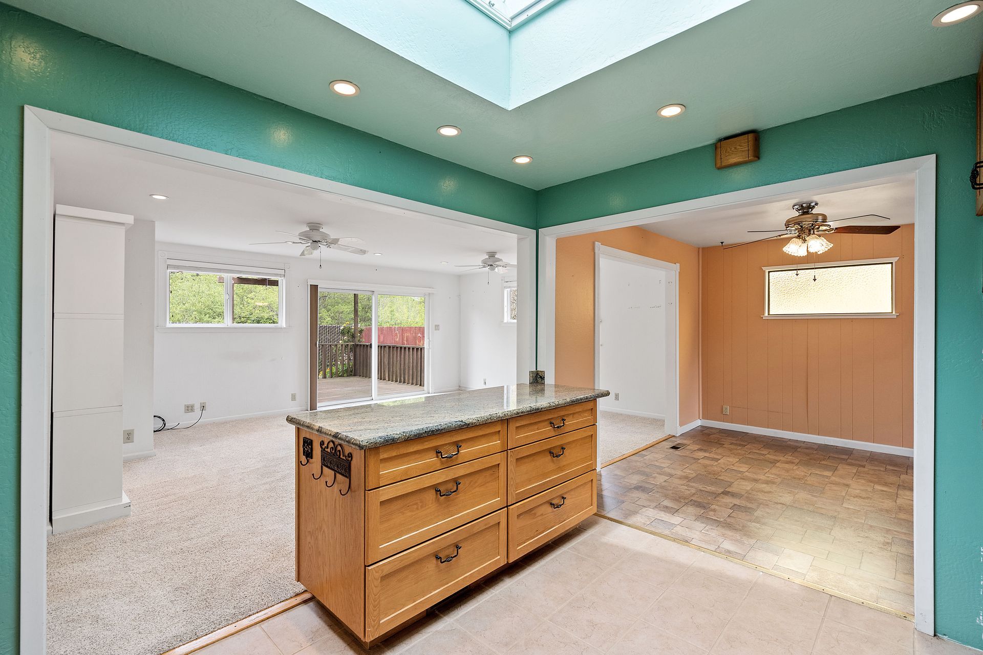 There is a skylight in the ceiling of the room.