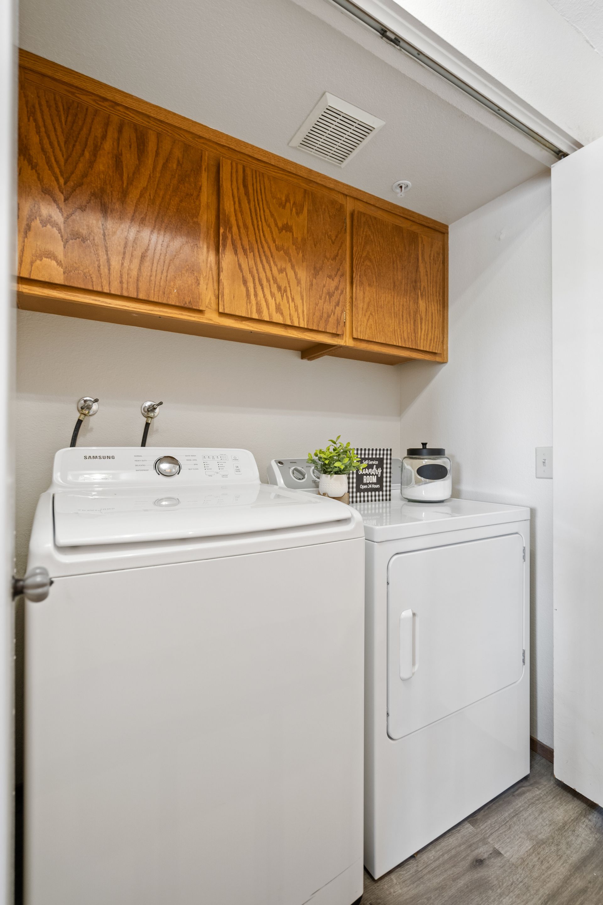 A laundry room with a washer and dryer in it.