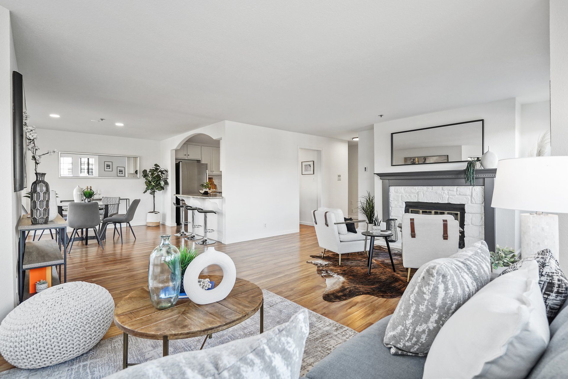 A living room with a couch and a fireplace
