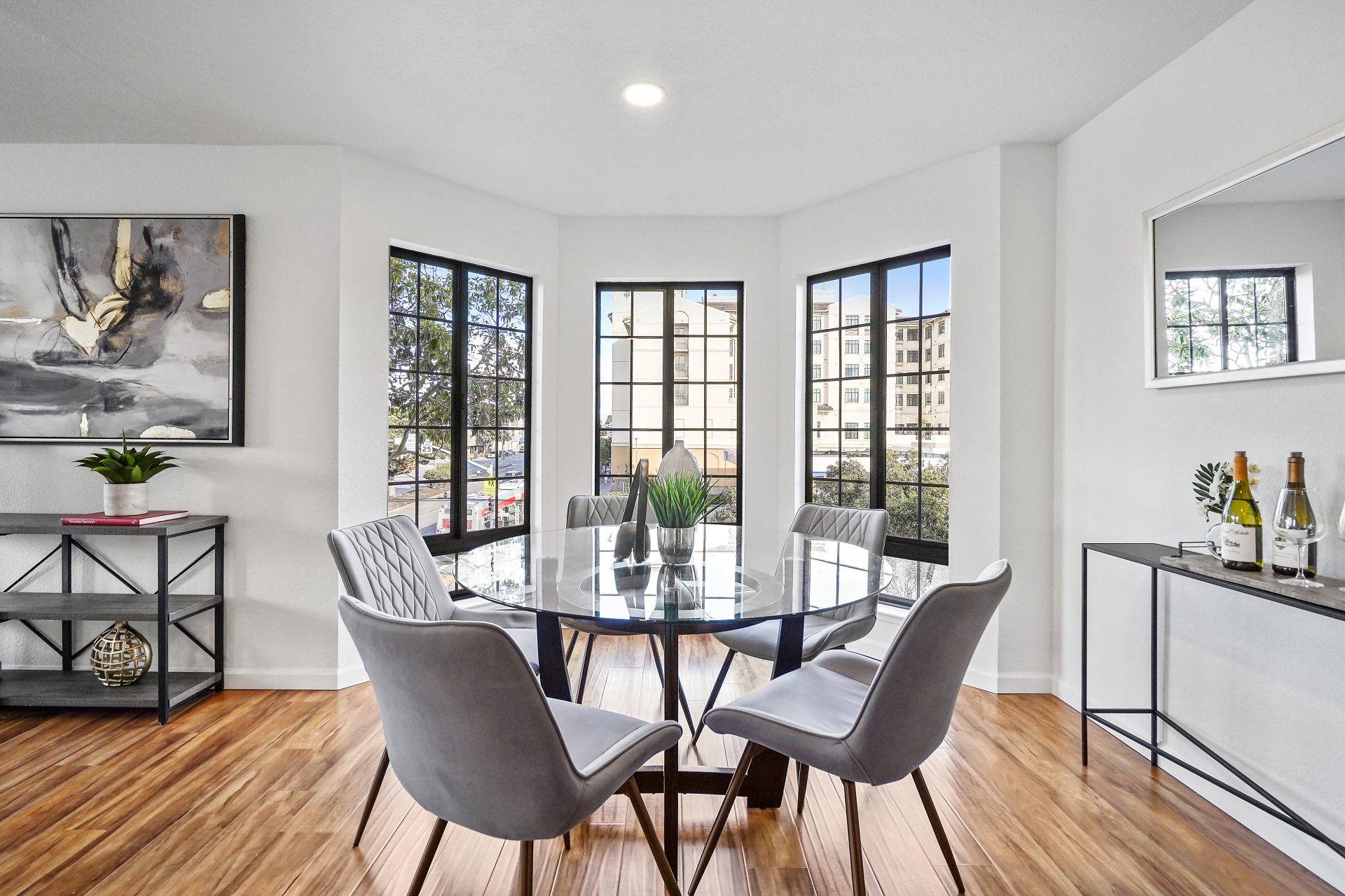 A dining room with a round table and chairs