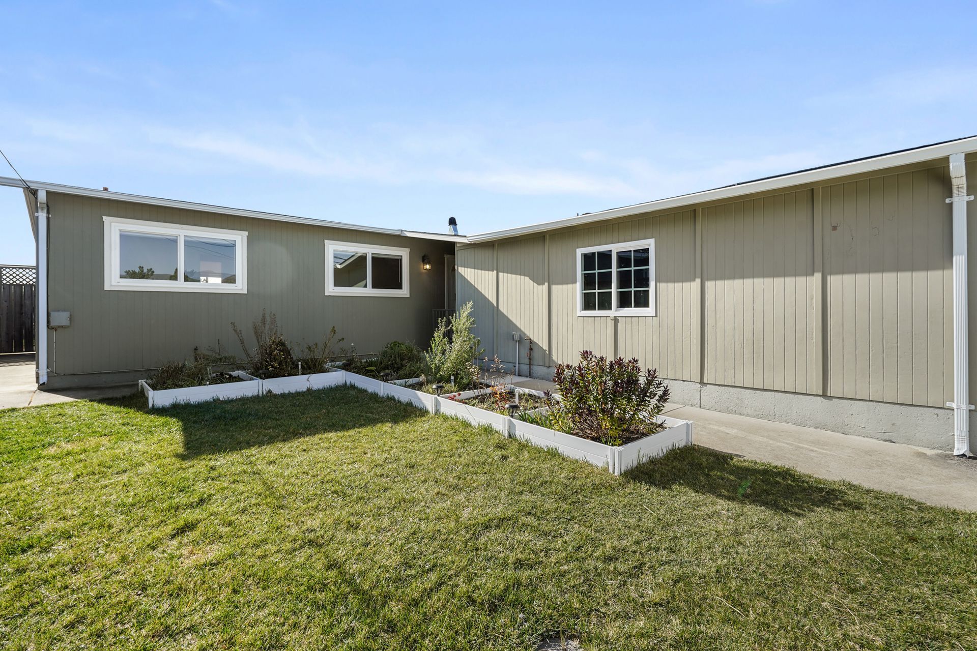 A house with a lawn in front of it.