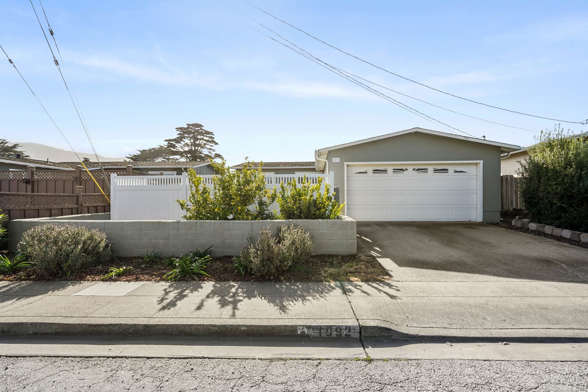 A house with a garage and a driveway.