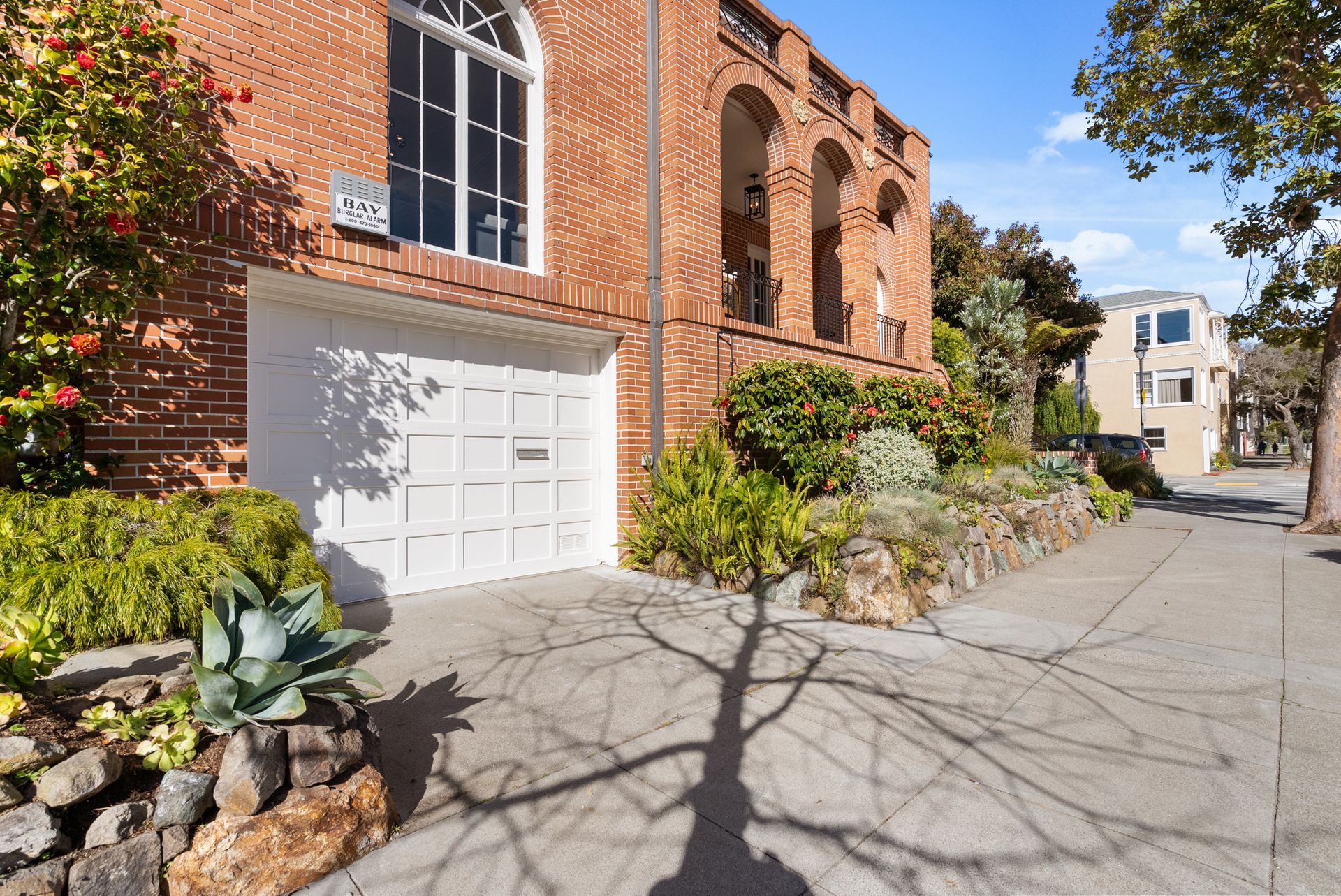 A large brick building with a white garage door
