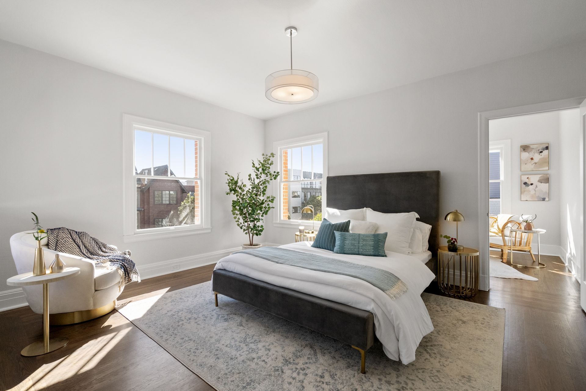 A bedroom with a bed and a chair