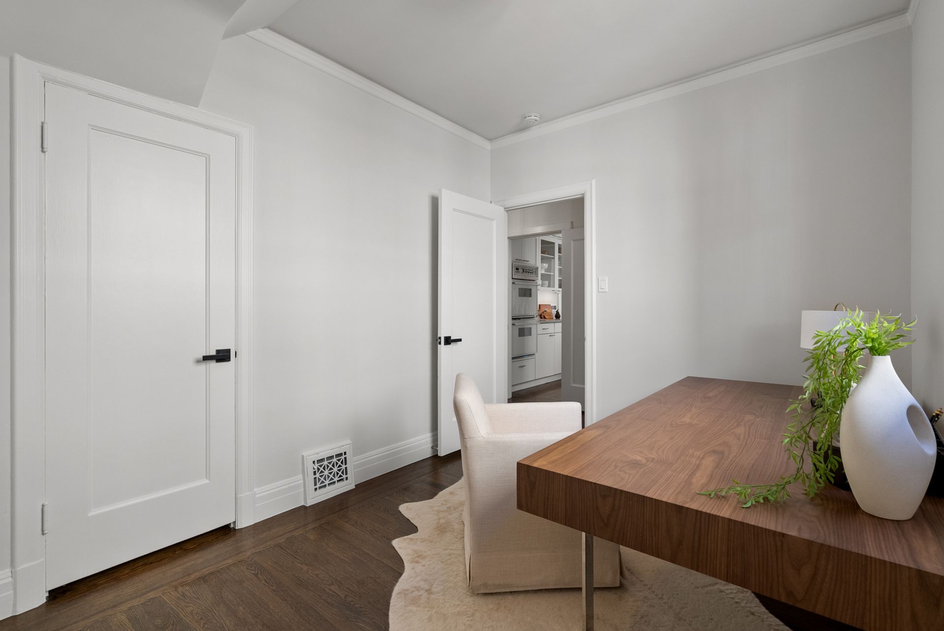 A room with a desk and chair in it