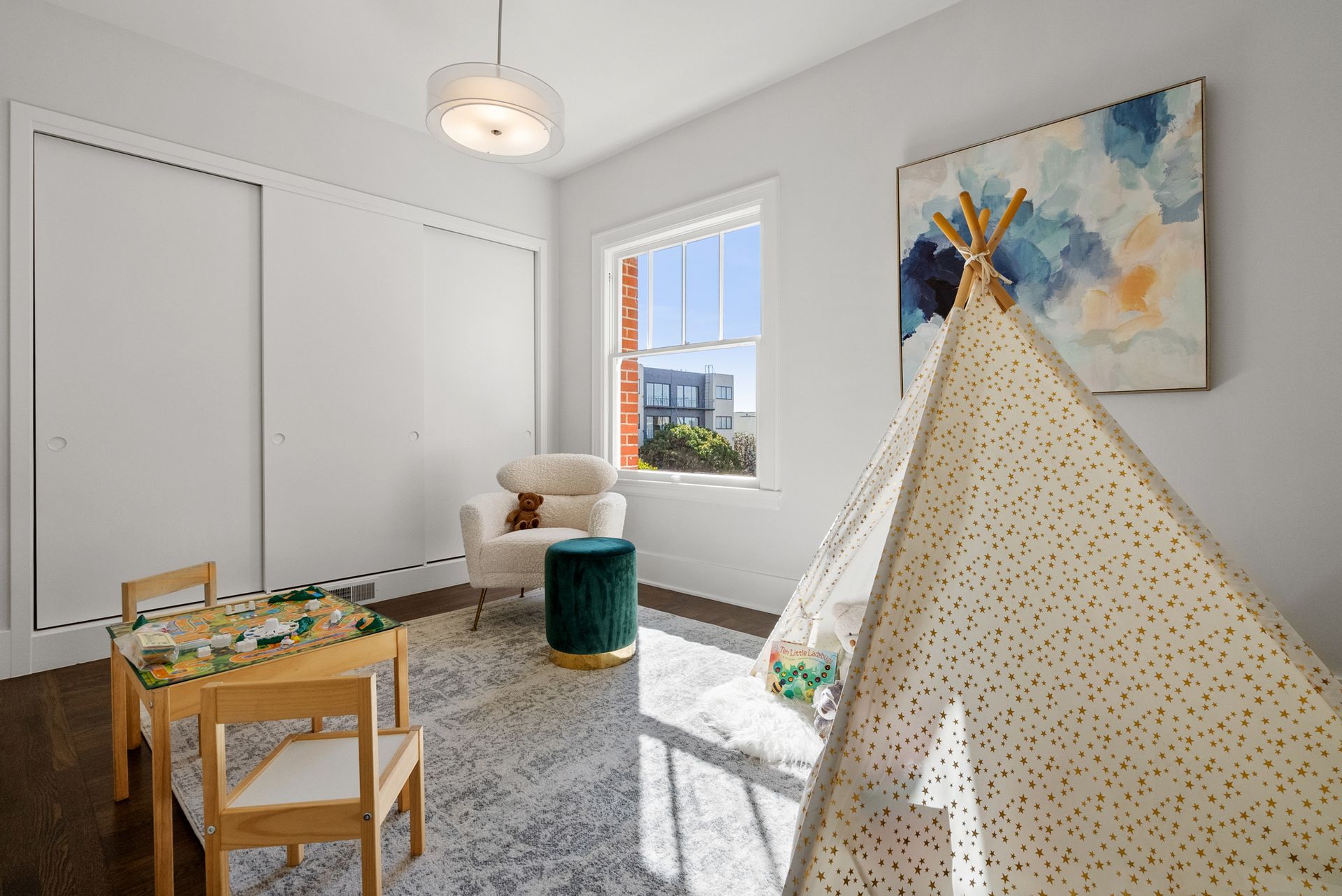 There is a teepee in the middle of the room.