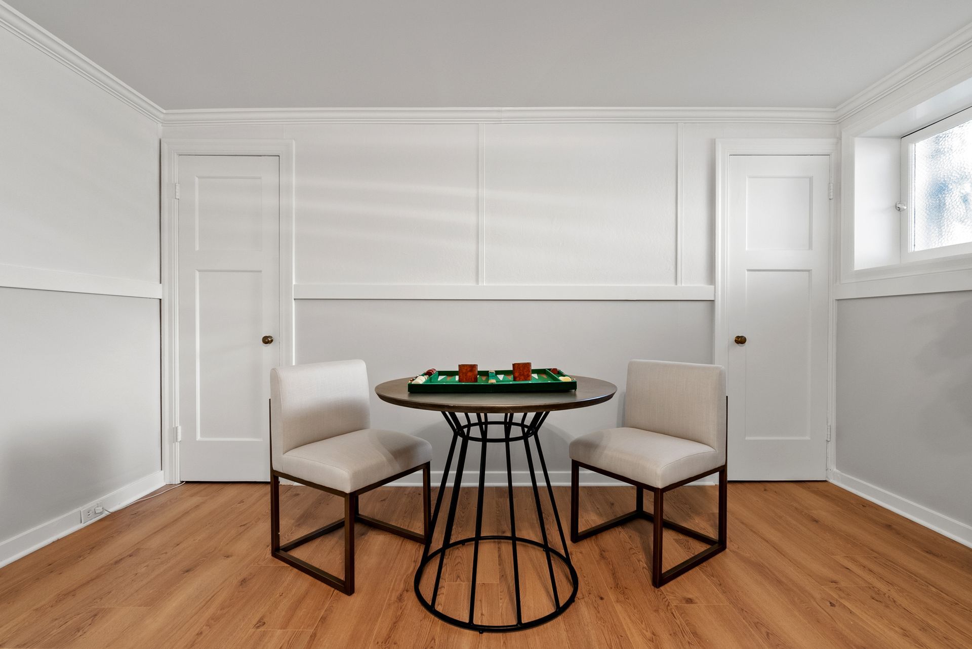 A room with a table and two chairs in it