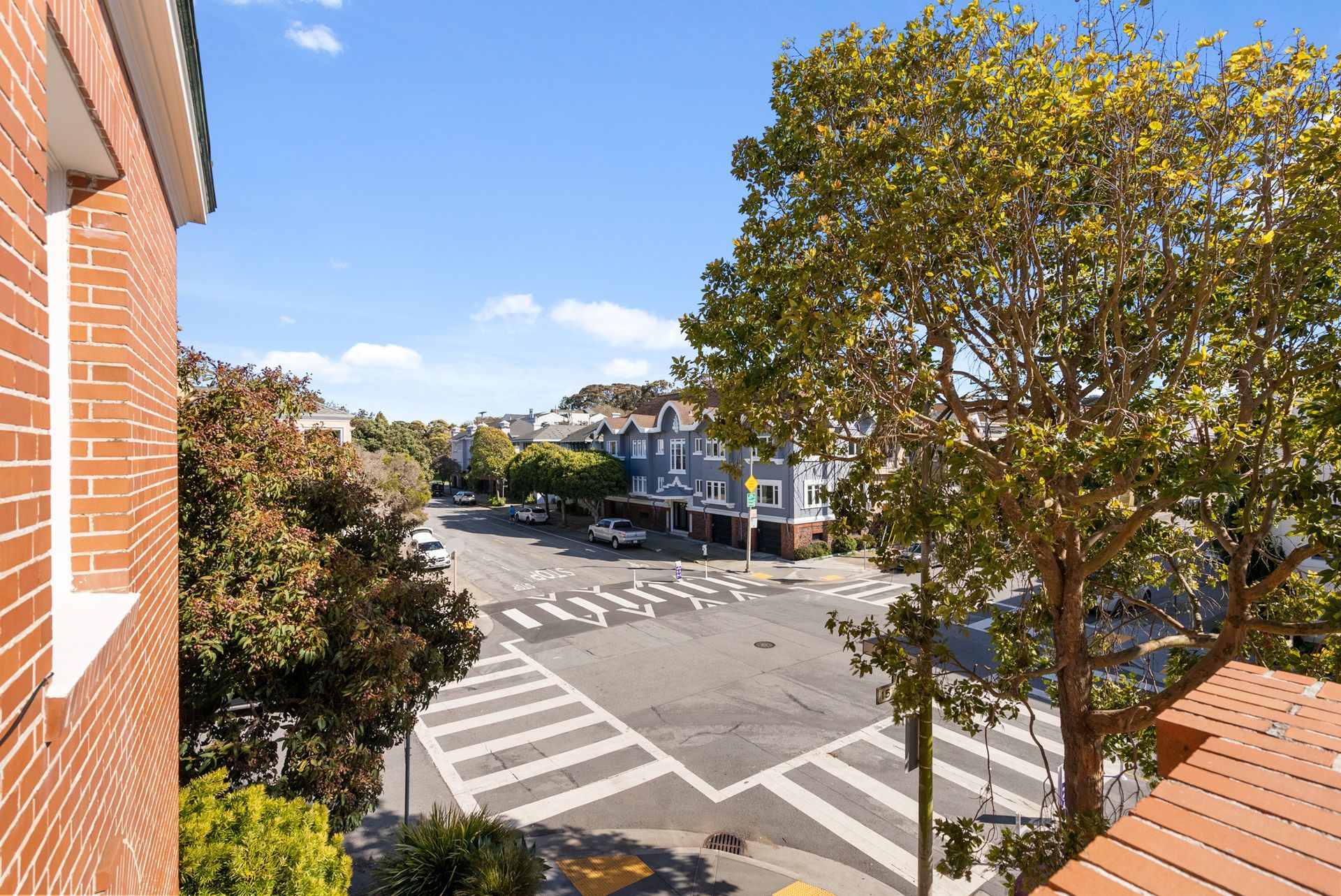 A view of a city street from a balcony.