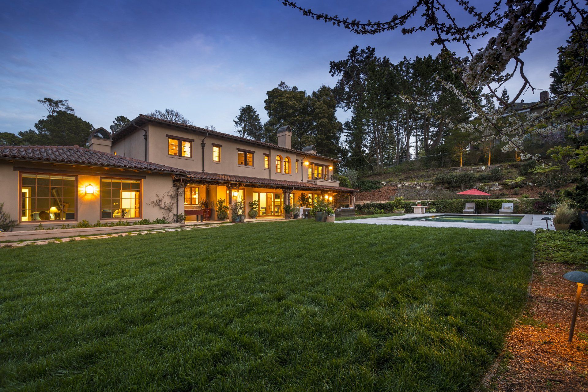 A large house with a large lawn in front of it
