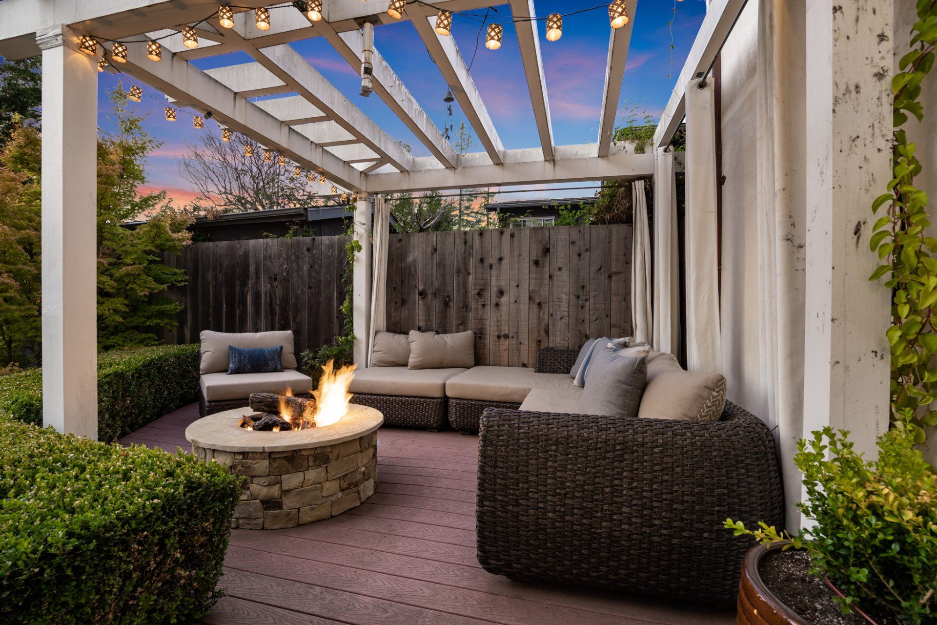 There is a fire pit in the middle of the patio.