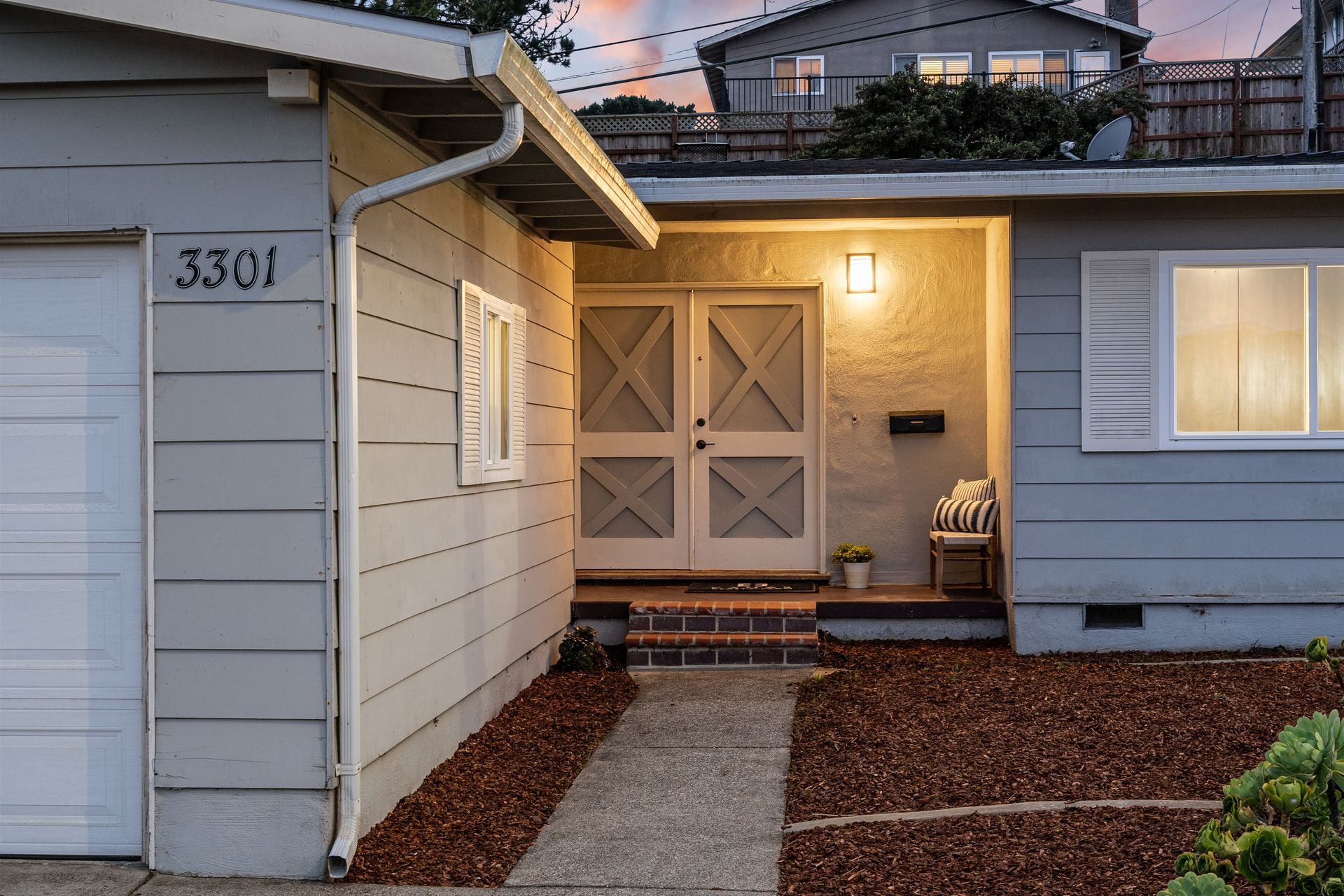 A house with the number 3301 on the side of it.