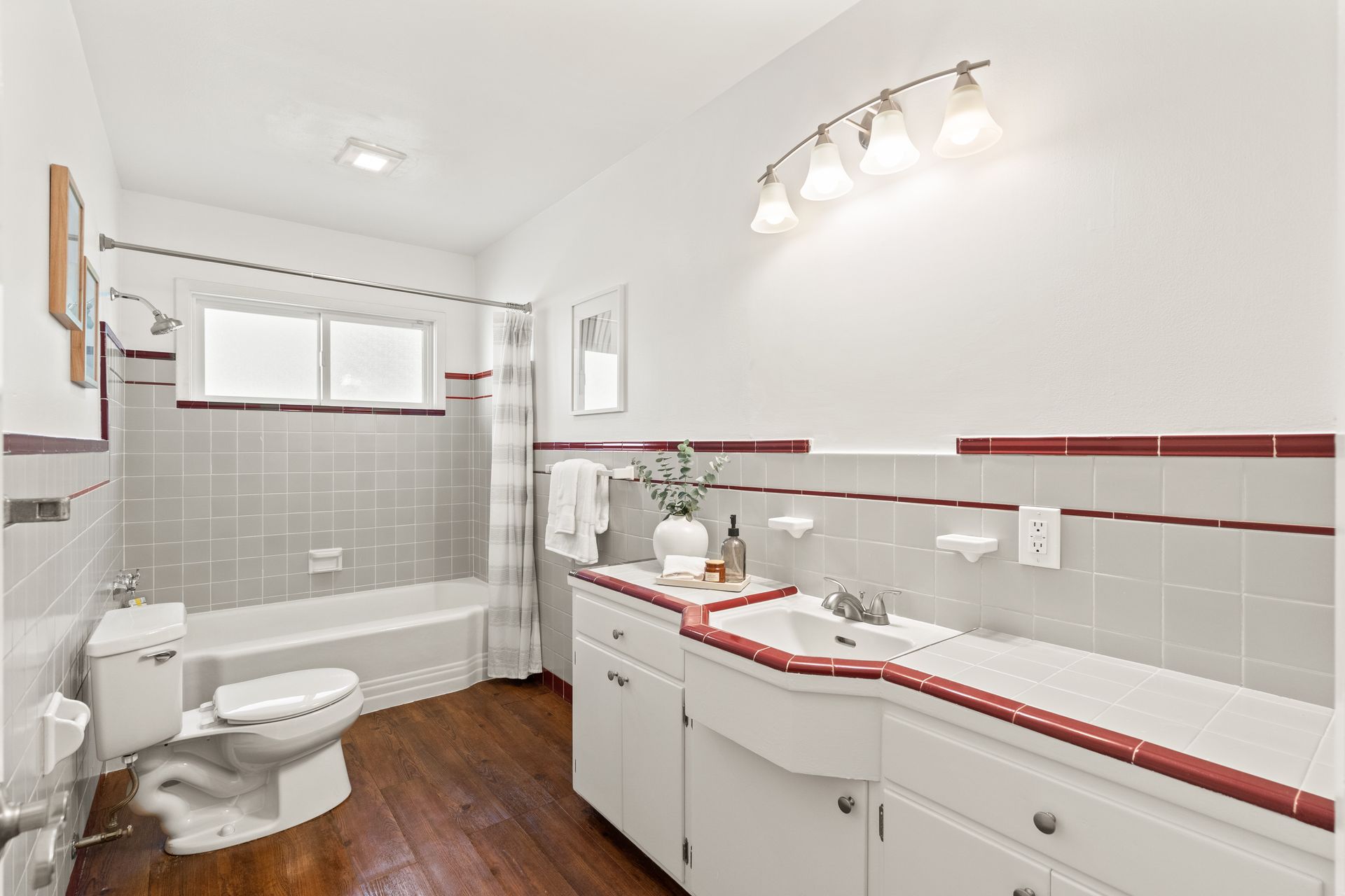 A bathroom with a toilet , sink and bathtub