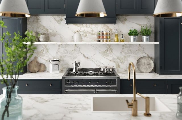 Bright, modern white kitchen with granite counters, stainless appliances, and large windows Bright, modern white kitchen with granite counters, stainless appliances, and large windows