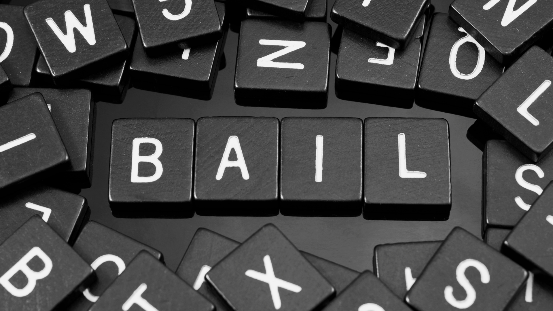 Black letter tiles spelling 