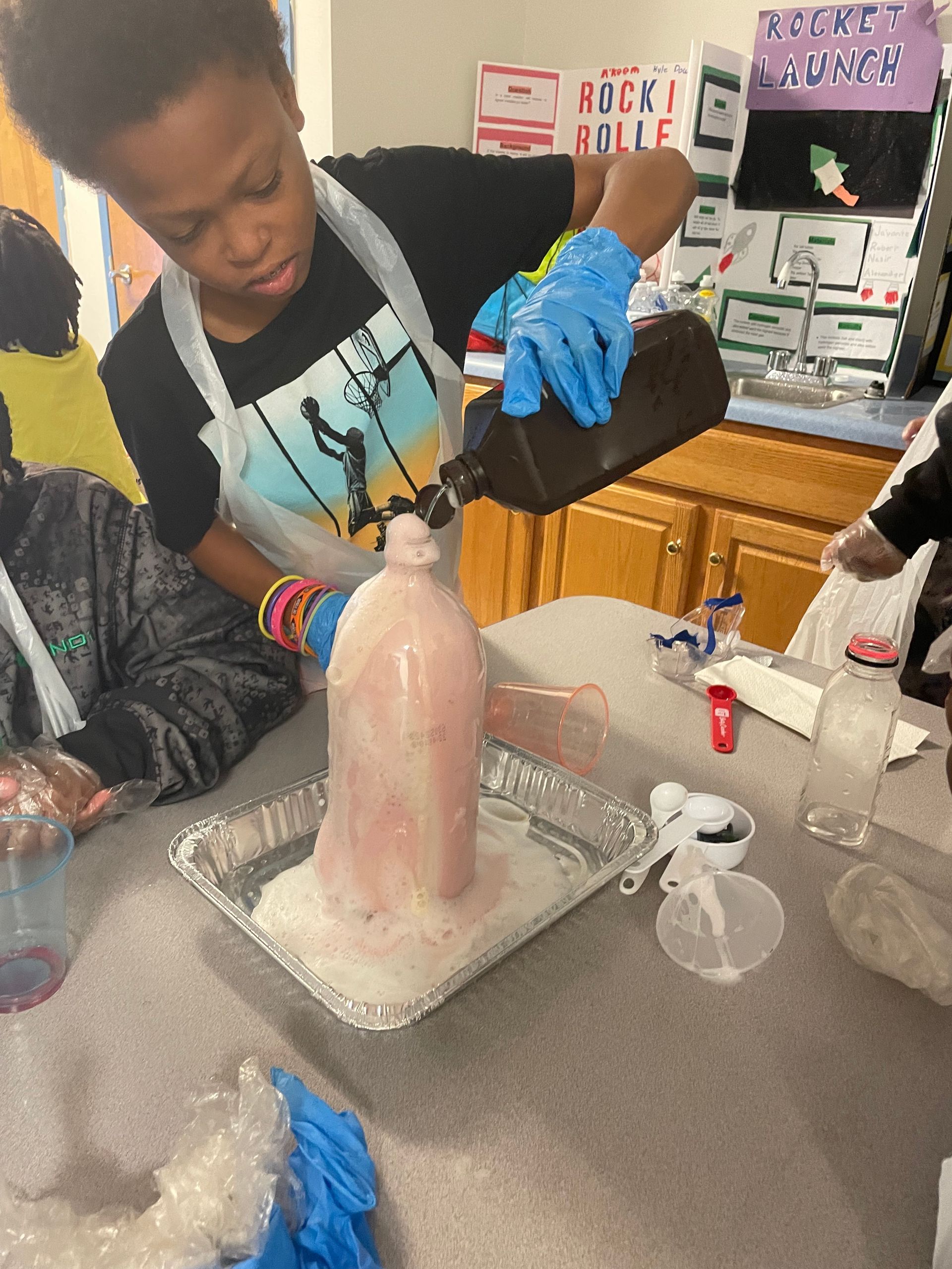 student is mixing up the chemical