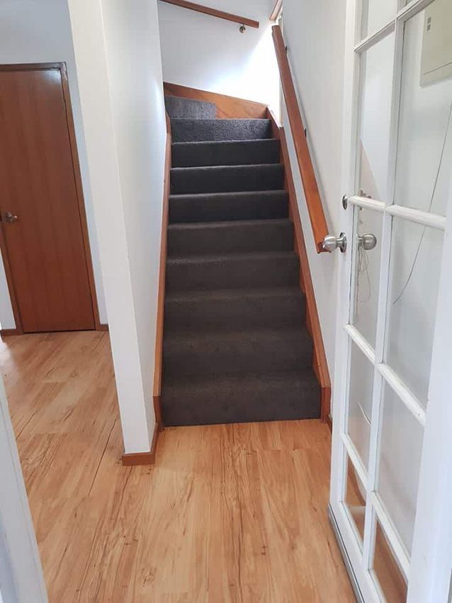 A Stairs Leading Up to the Second Floor of a House — Canberra Floor Coverings in Queanbeyan, NSW